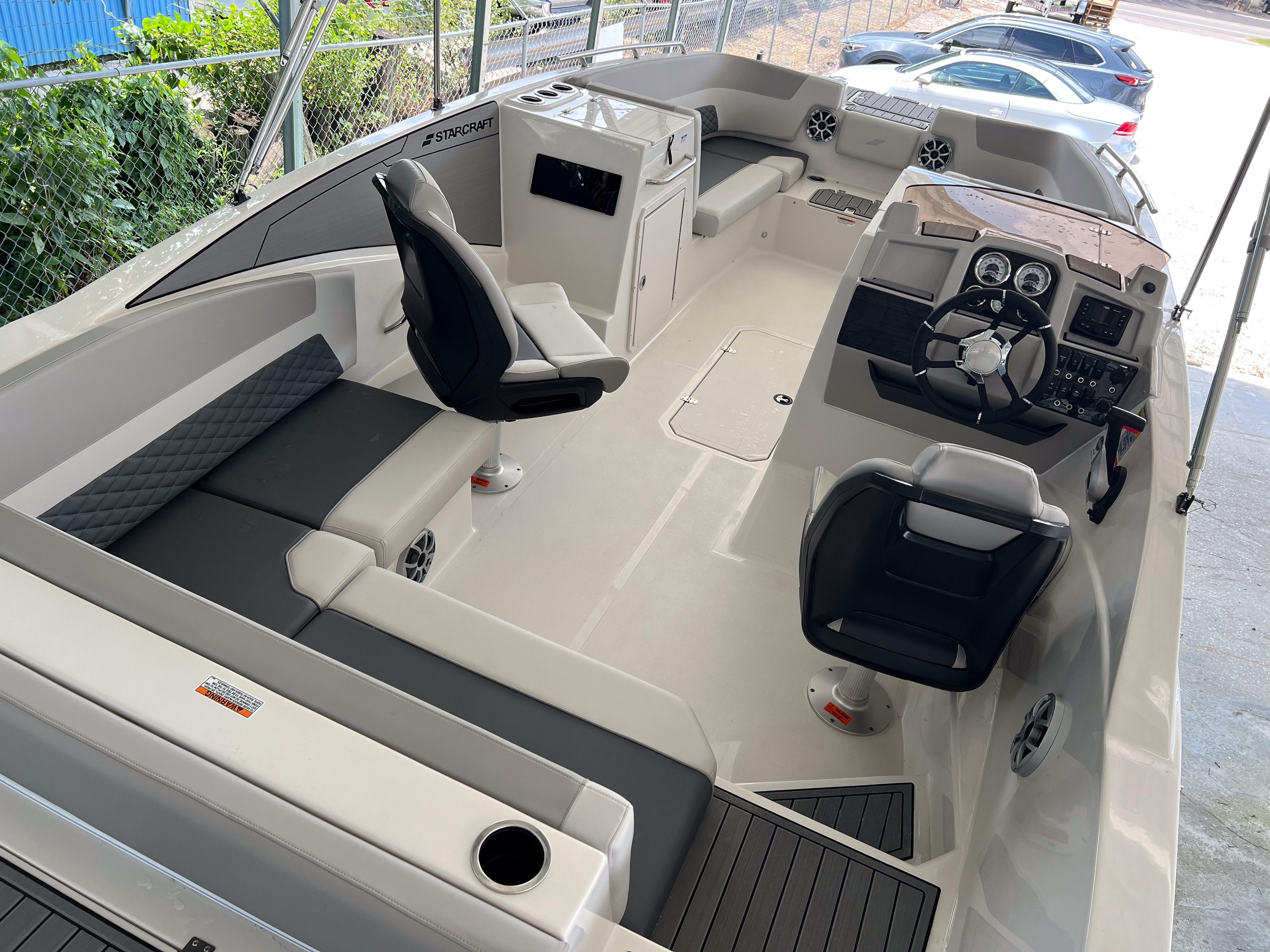 2026 Starcraft SVX 231 OB boat interior with modern seating and steering console.