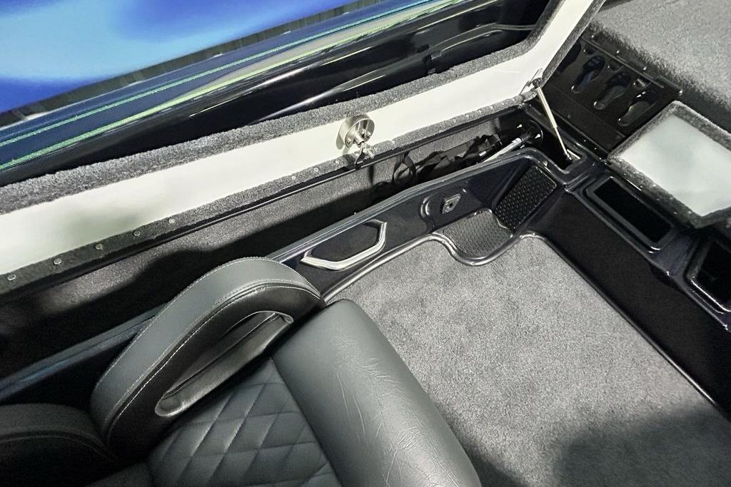 Interior of 2026 Phoenix 819 ZXL boat with sleek seating and storage compartments.