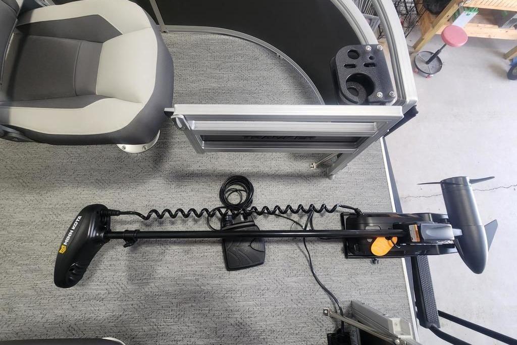 2026 Sun Tracker Bass Buggy 16 DLX boat interior with trolling motor and seating.