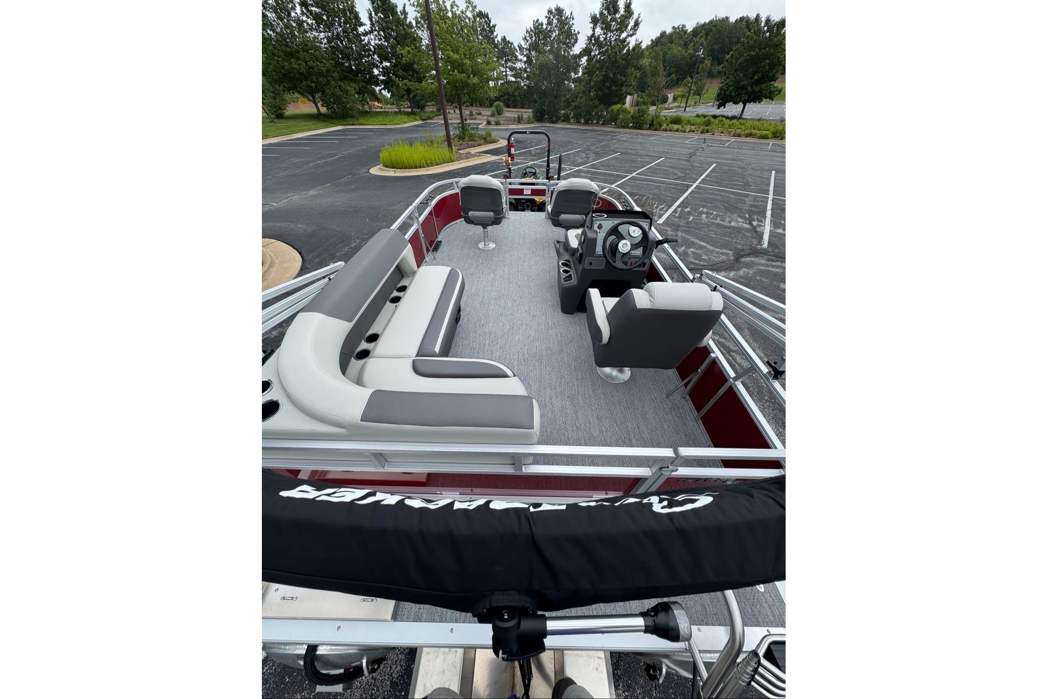 2026 Sun Tracker Bass Buggy 16 XL Select pontoon boat with spacious seating and modern design.