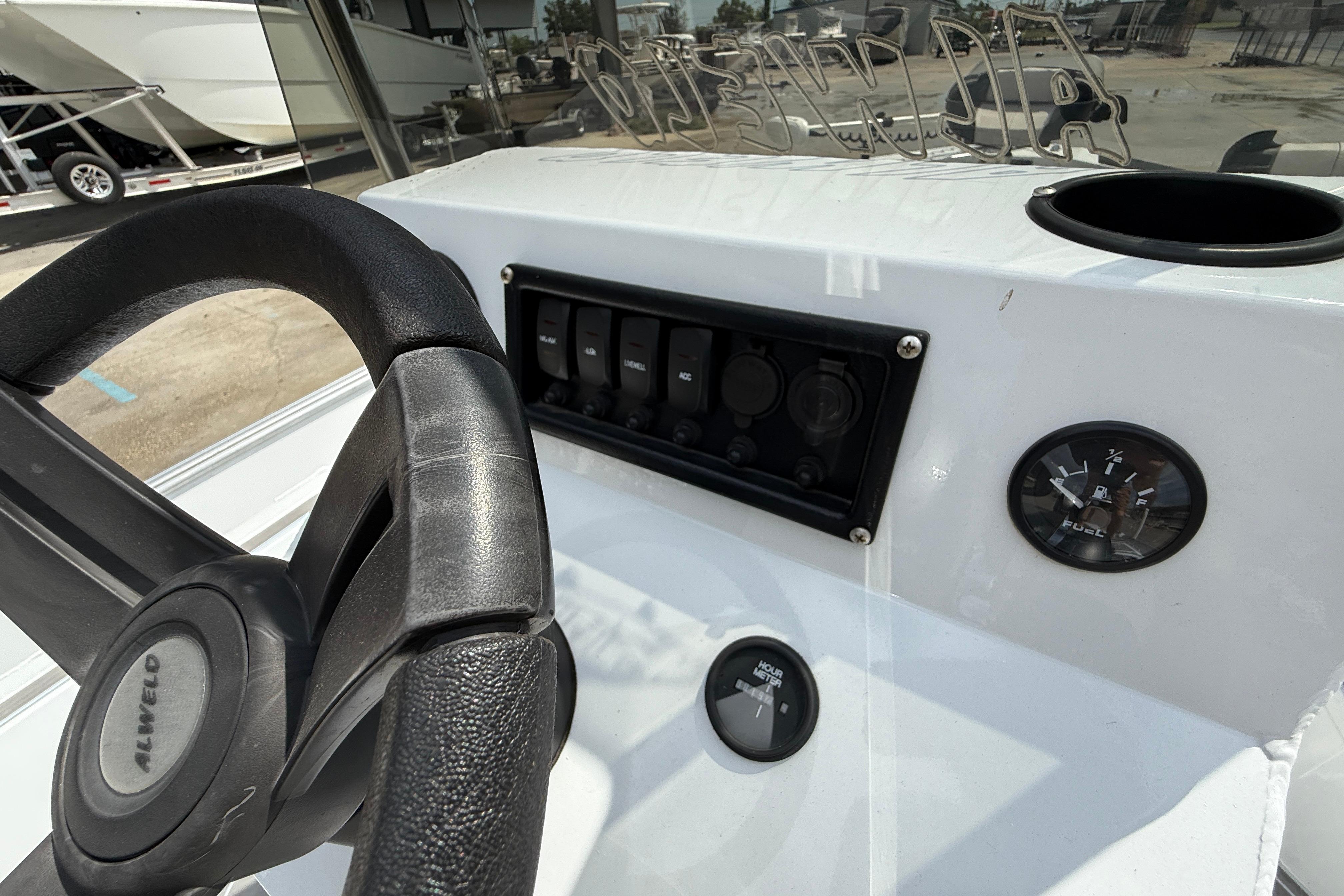 2024 Alweld 2070cc boat dashboard with steering wheel and fuel gauge.