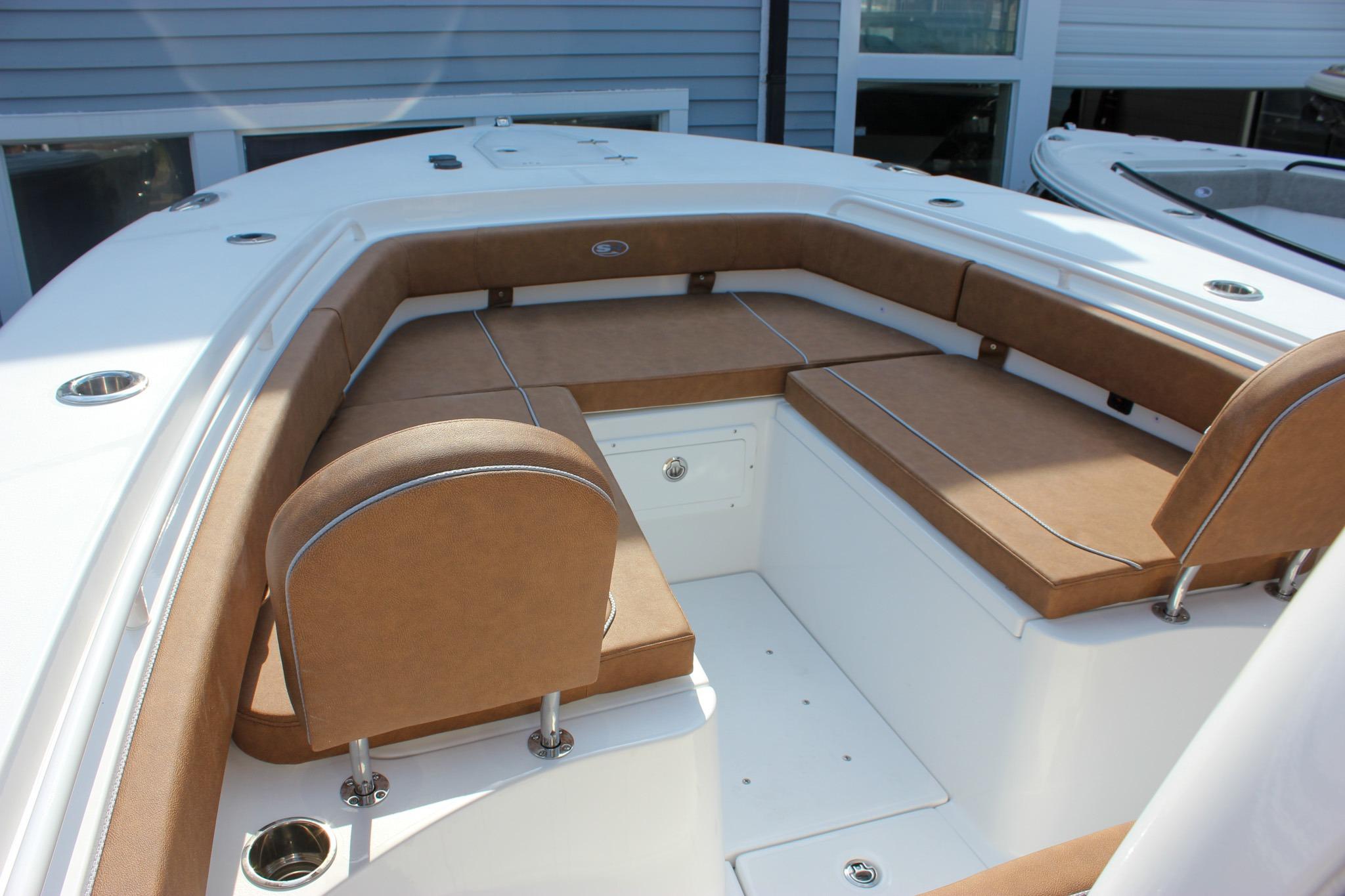 2027 Sea Hunt Ultra 275 SE boat with tan cushioned seating and white deck.