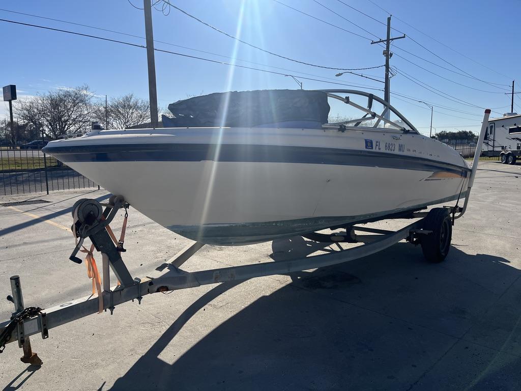 2004 Bayliner 175 boat on trailer in sunny setting.