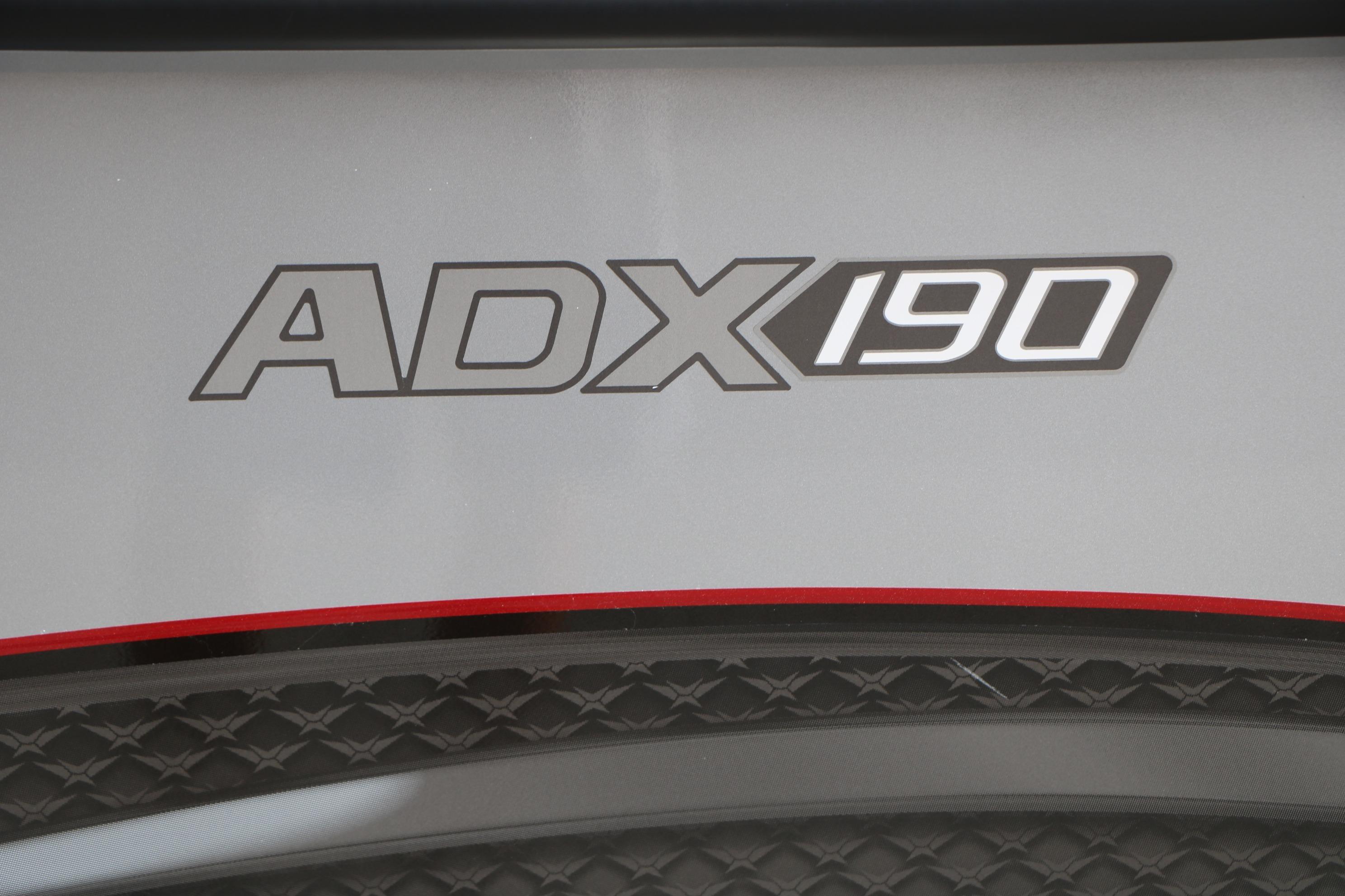 Vexus ADX 190 logo on sleek surface, 2026 model design.