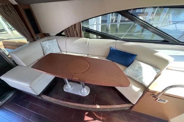 Luxurious interior of 2016 Sea Ray Sundancer 510 yacht with elegant seating and table.