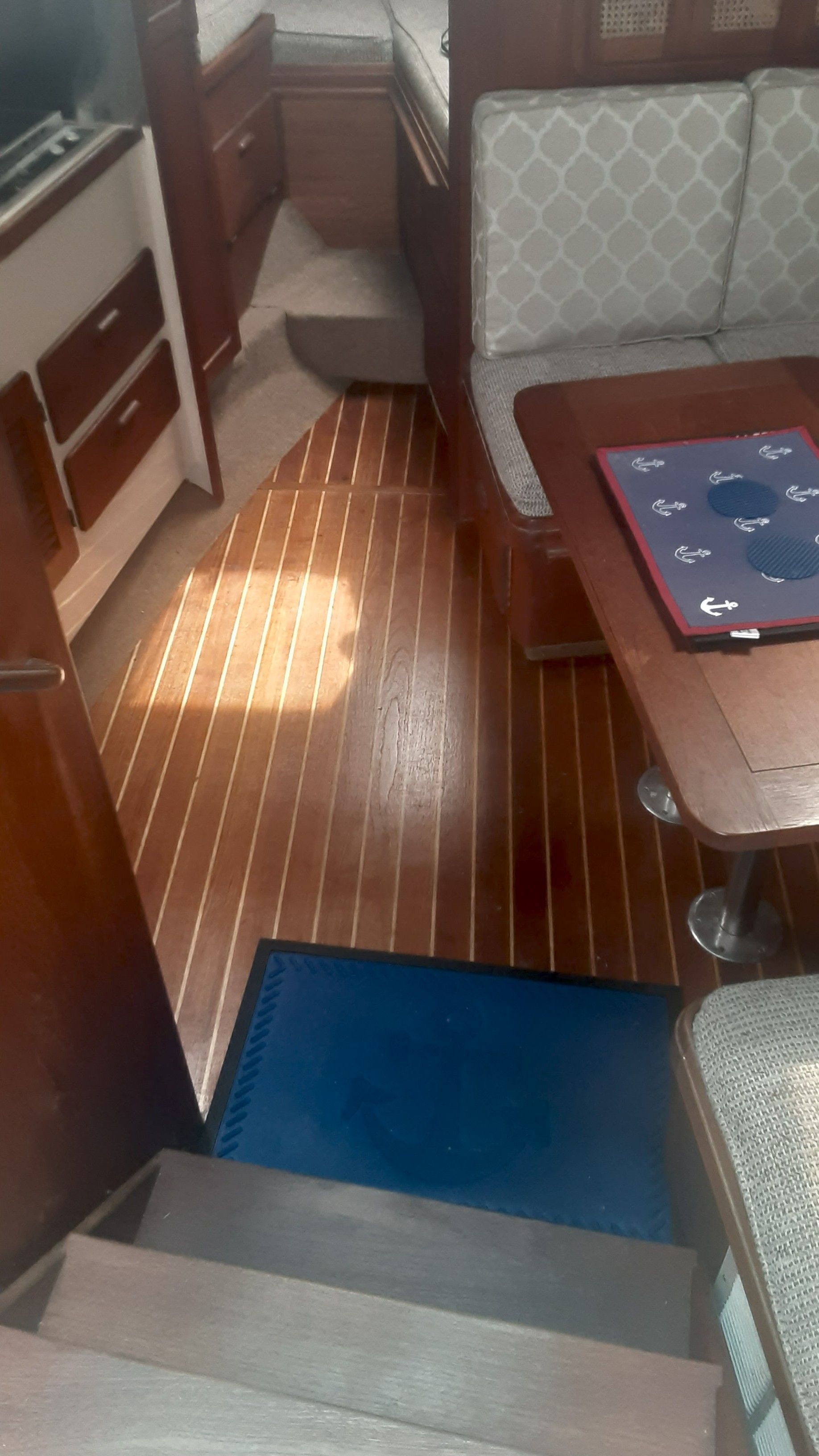 Interior of a 1985 Tiara Yachts 3100 Open with wooden flooring.