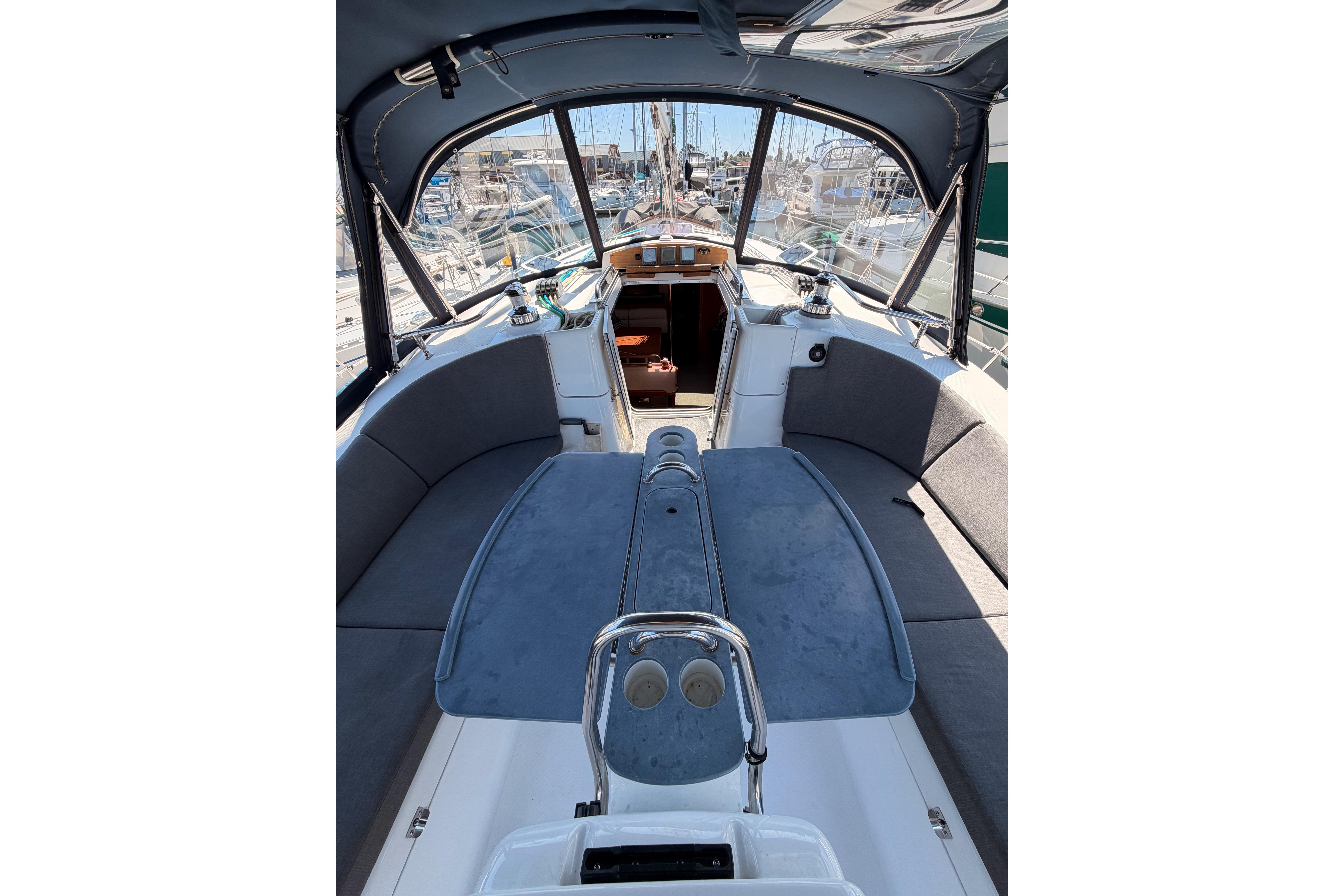 Interior view of a 2008 Hunter 45 Deck Salon sailboat, featuring spacious seating and helm.
