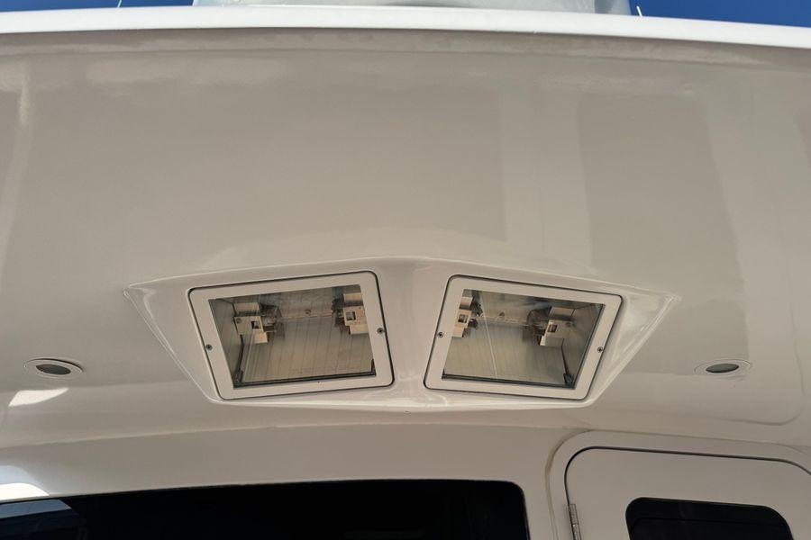 Ceiling view of 2002 Viking 61 Enclosed Bridge yacht with recessed lighting fixtures.