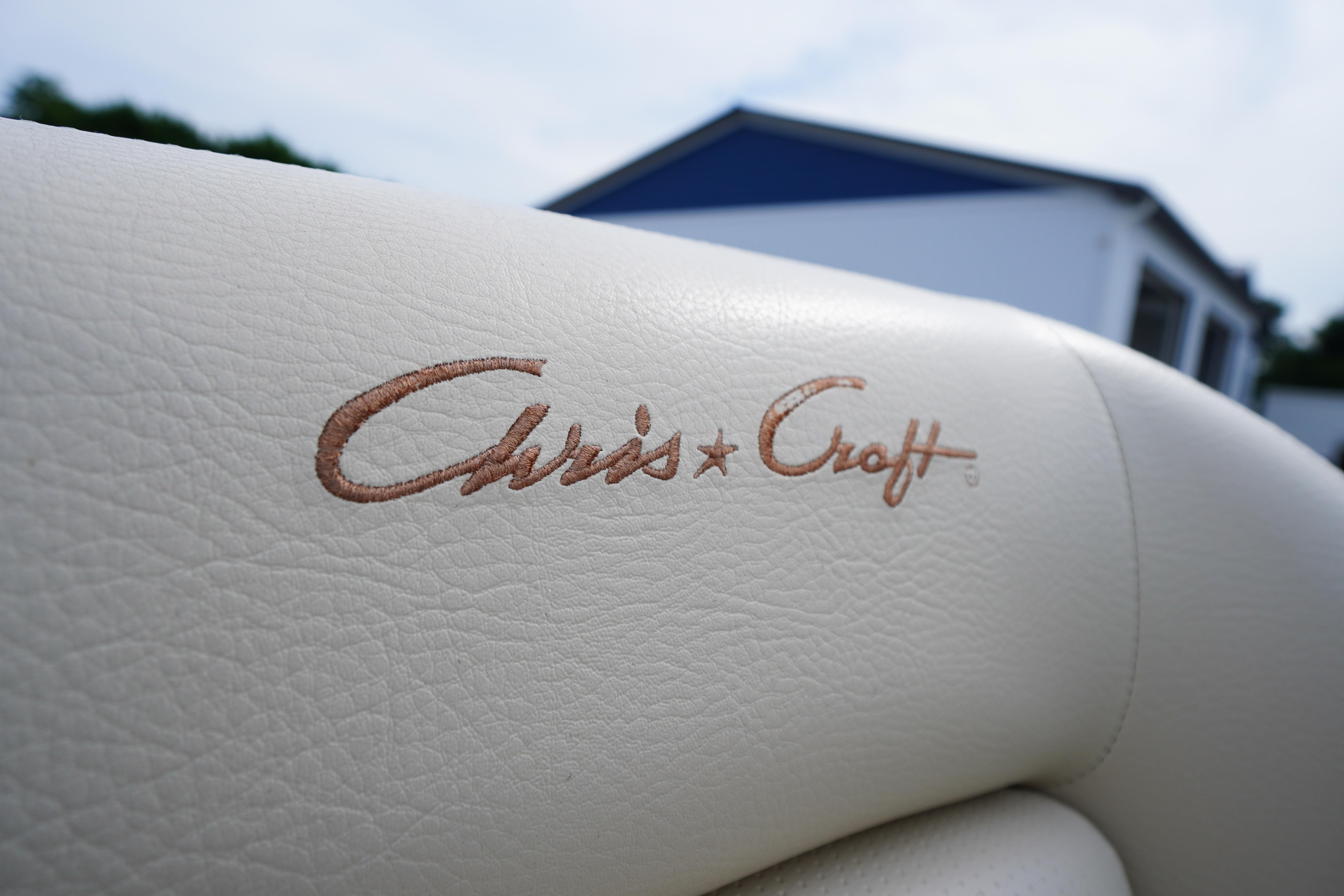 Close-up of 2005 Chris Craft Speedster Heritage leather seat with logo embroidery.