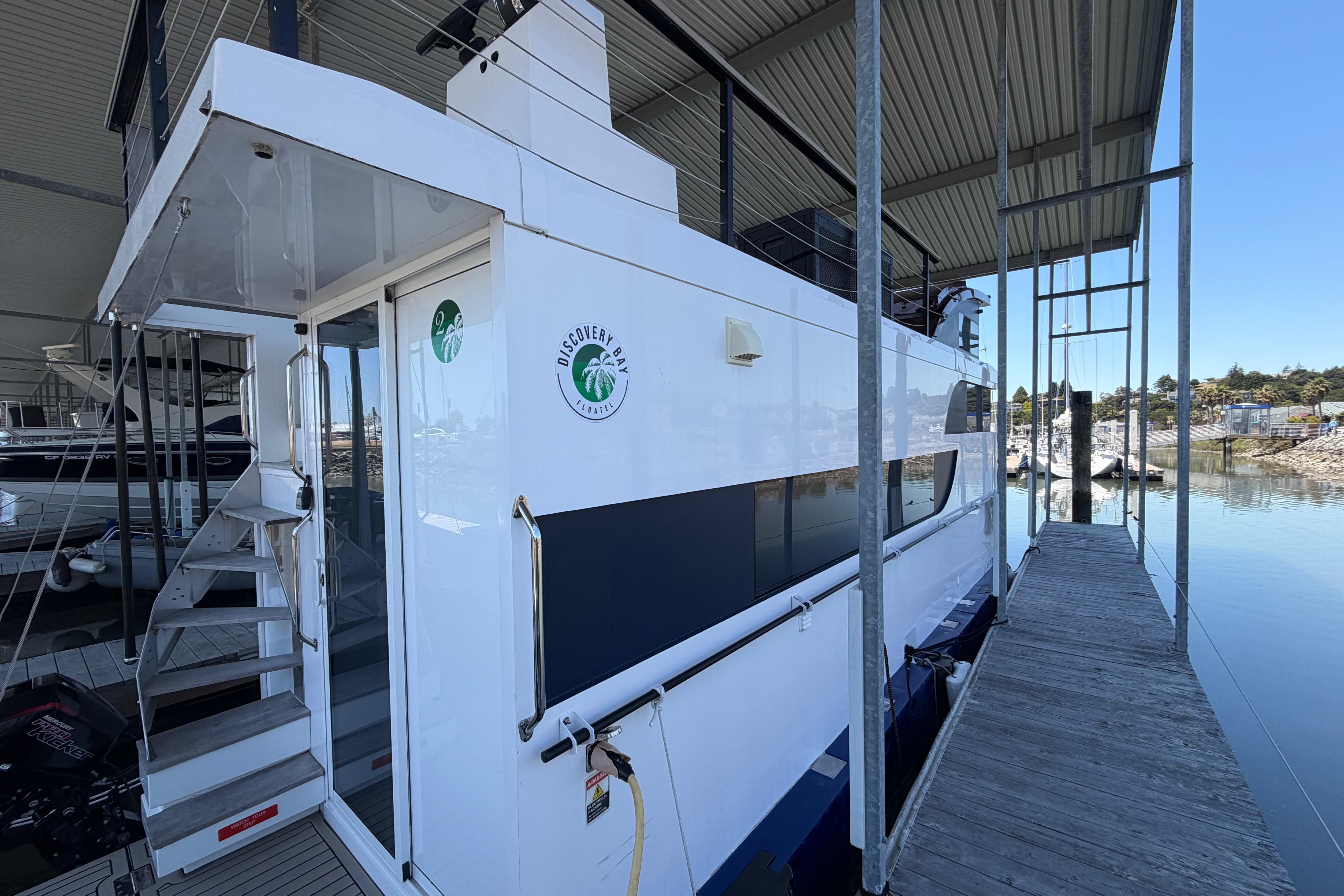 Navisyo NV.08 2022 yacht docked at marina, featuring sleek design and modern amenities.
