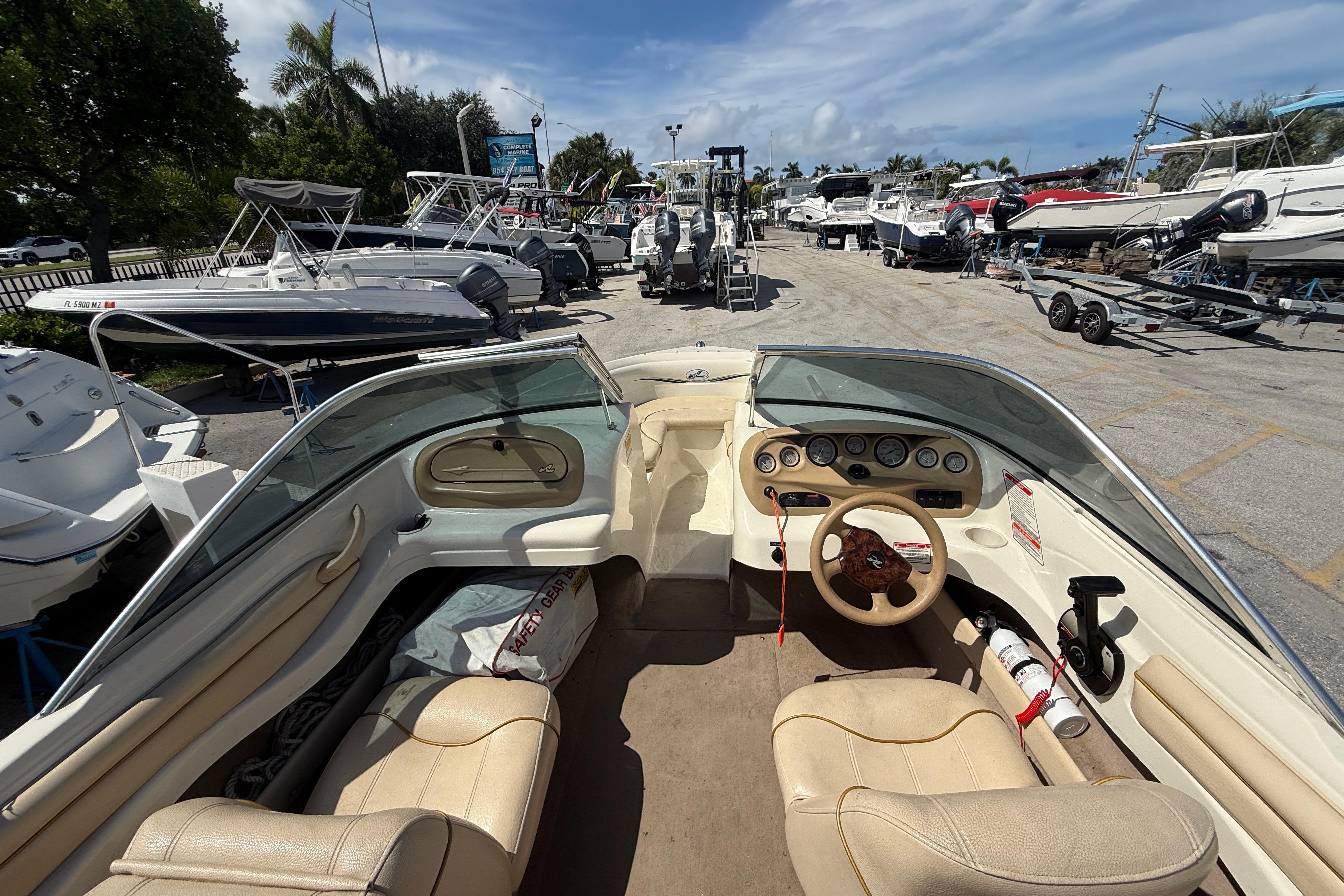 Interior view of a 2001 Sea Ray 180 Bow Rider boat at a marina.