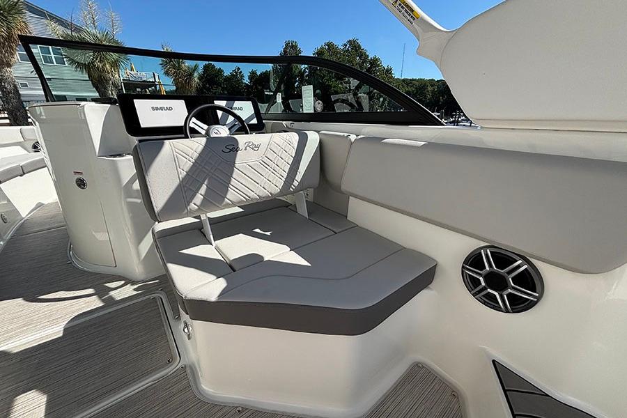 2027 Sea Ray SDX 230 Outboard boat interior with seating and steering wheel.