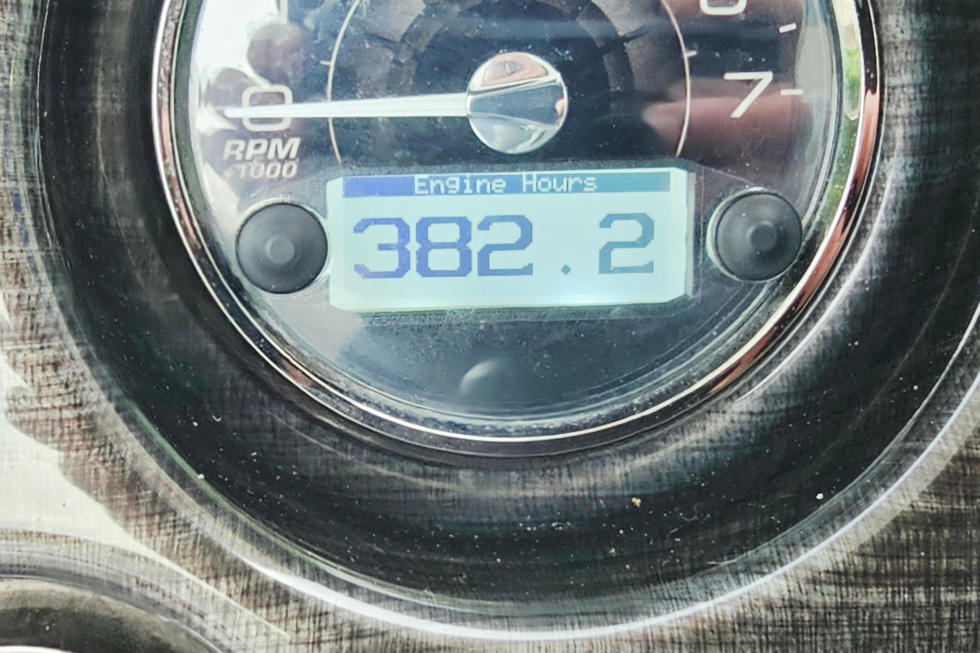Close-up of a 2016 Monterey 295 Sport Yacht engine hour meter displaying 382.2 hours.