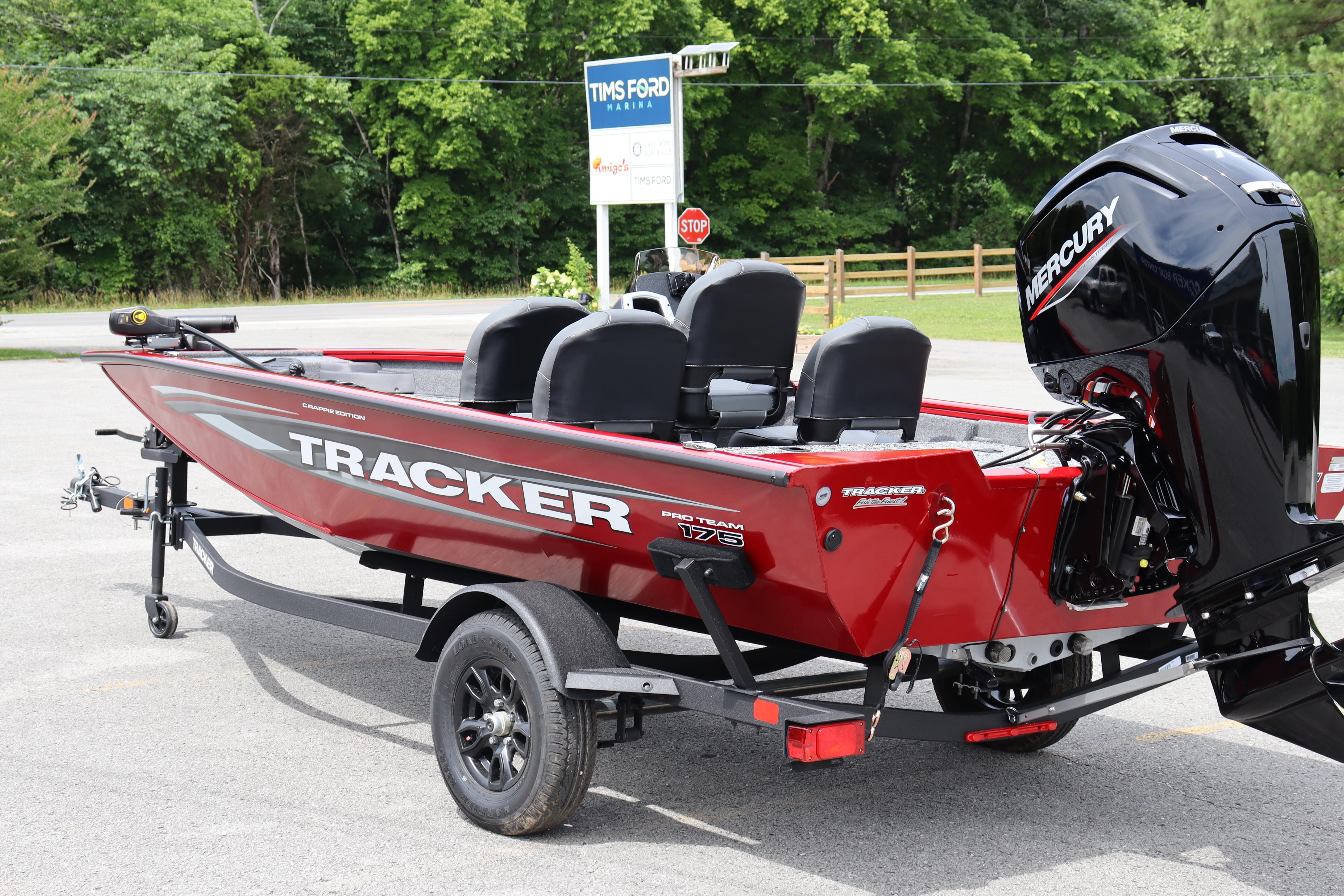 2026 Tracker Pro Team 175 Crappie Edition boat with Mercury engine, parked outdoors.