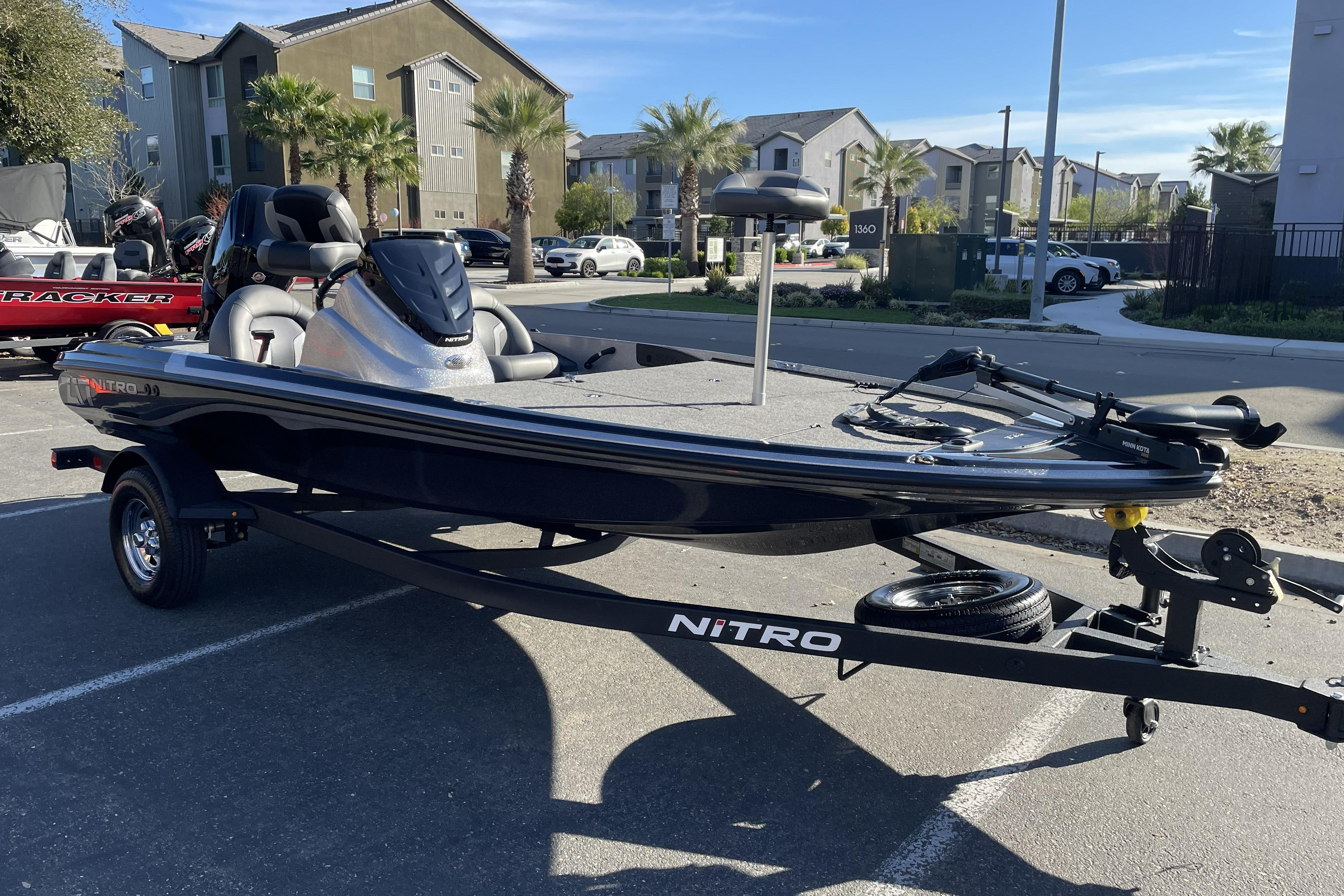 2026 Nitro Z17 boat parked in a residential area, showcasing sleek design and modern features.