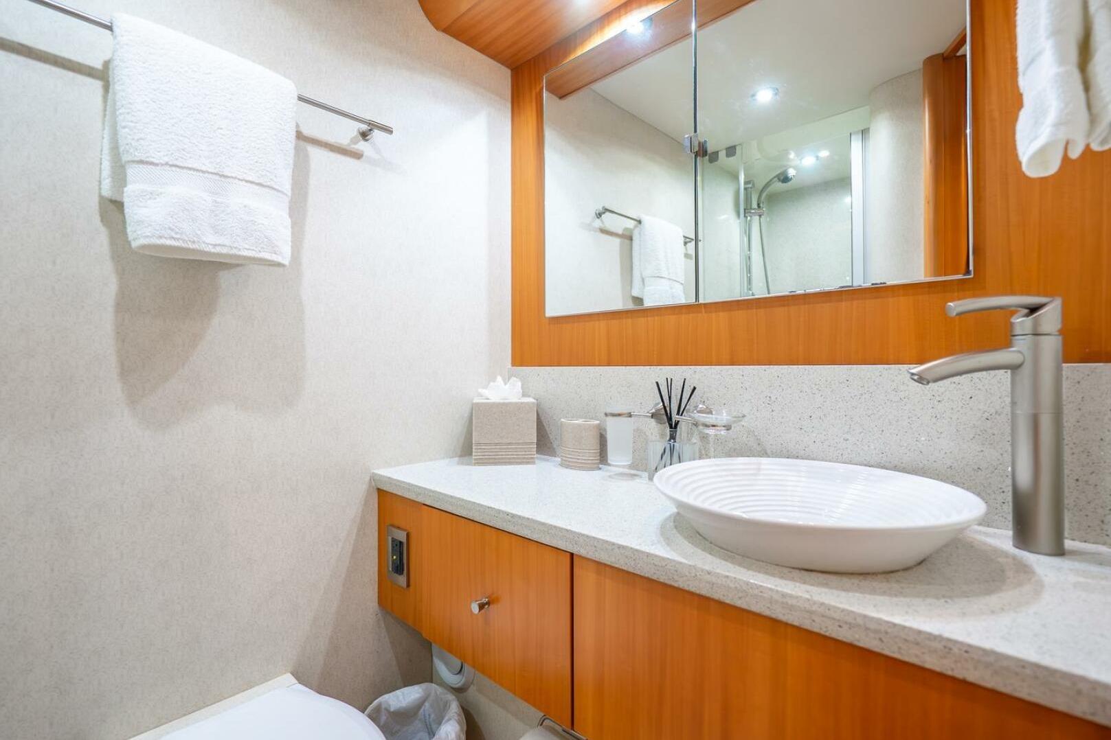 Luxurious bathroom in 2008 Lazzara Motor Yacht with modern fixtures and elegant design.