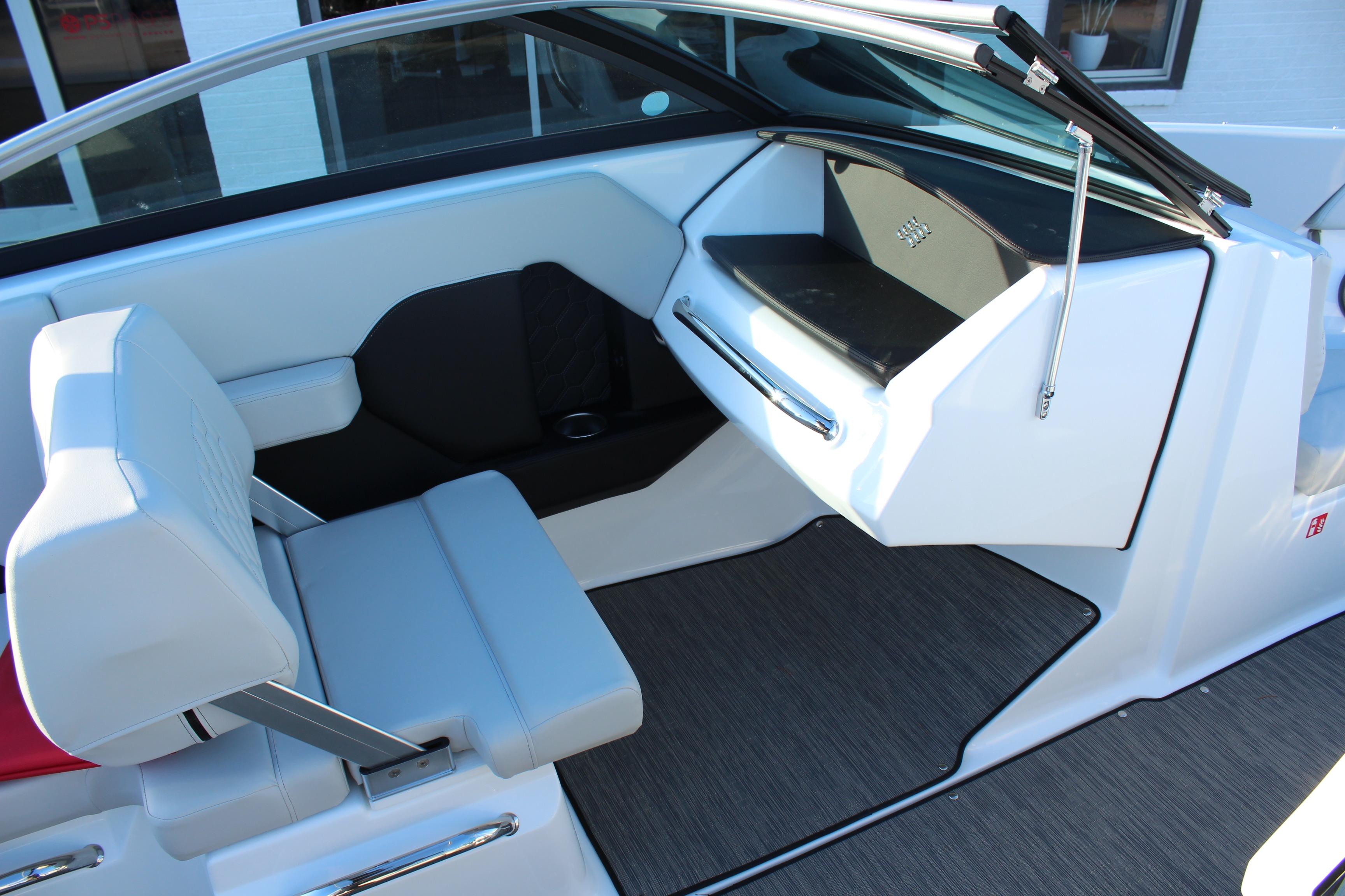 Interior of 2026 Four Winns H2 Freedom boat with modern seating and dashboard design.