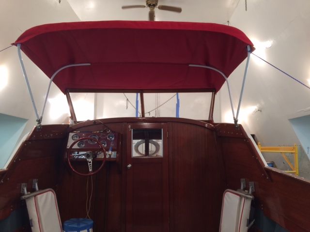 The image shows the cockpit of a 1959 Owens Flagship with a red canopy.