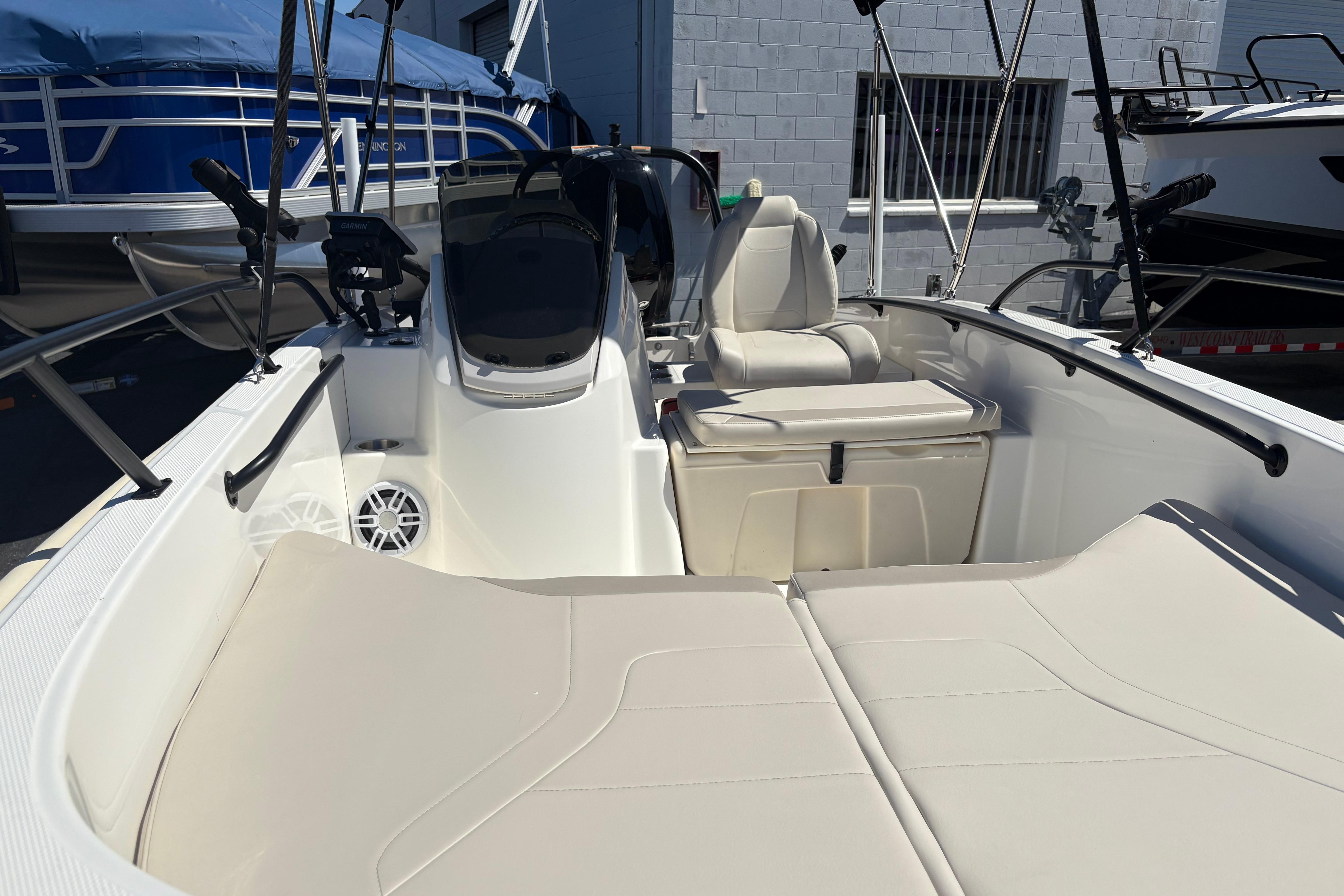 2024 Boston Whaler 160 Super Sport boat interior with seating and steering console.