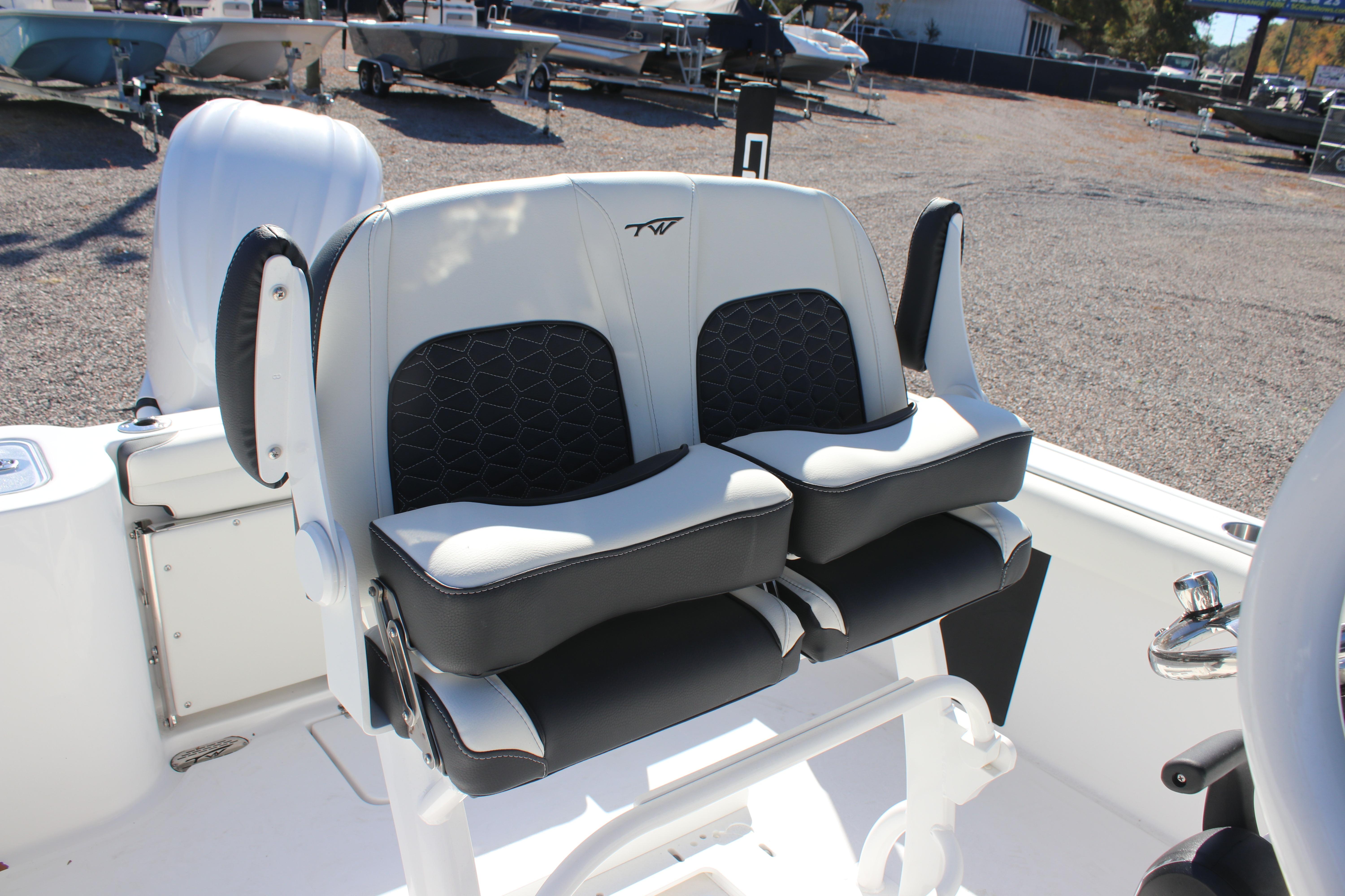 2026 Tidewater 232 CC Adventure boat seats, featuring sleek black and white design.