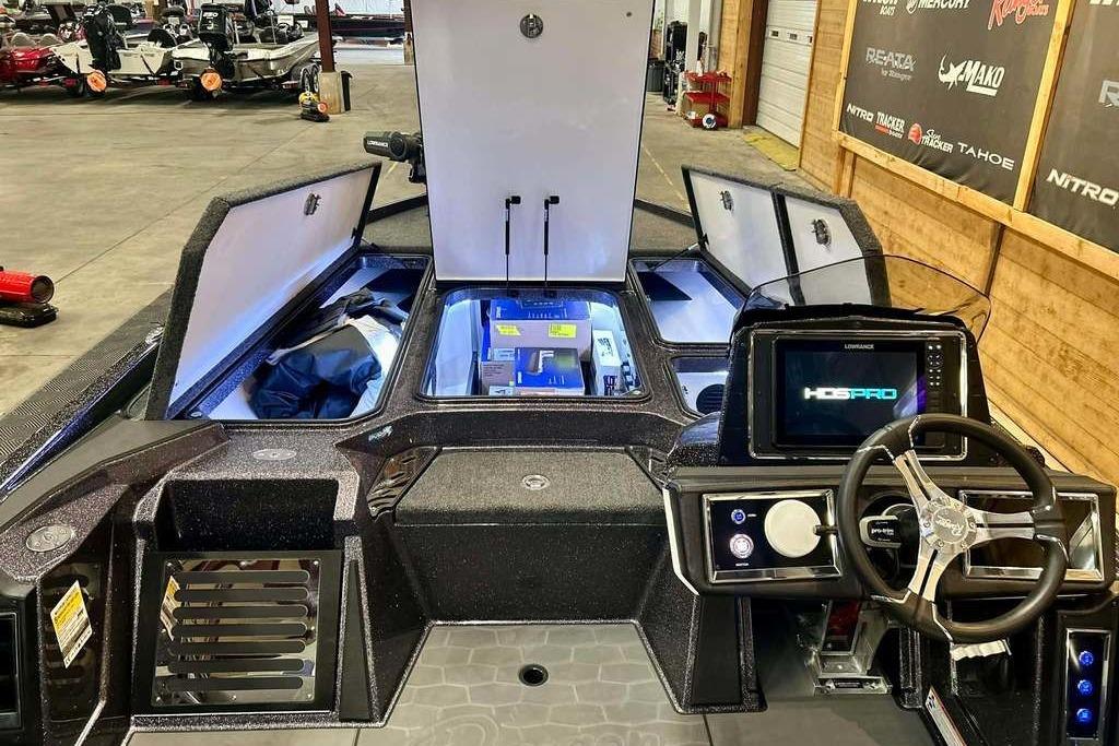 2026 Ranger Z521R Cup-Equipped boat interior with advanced navigation system and storage compartments.