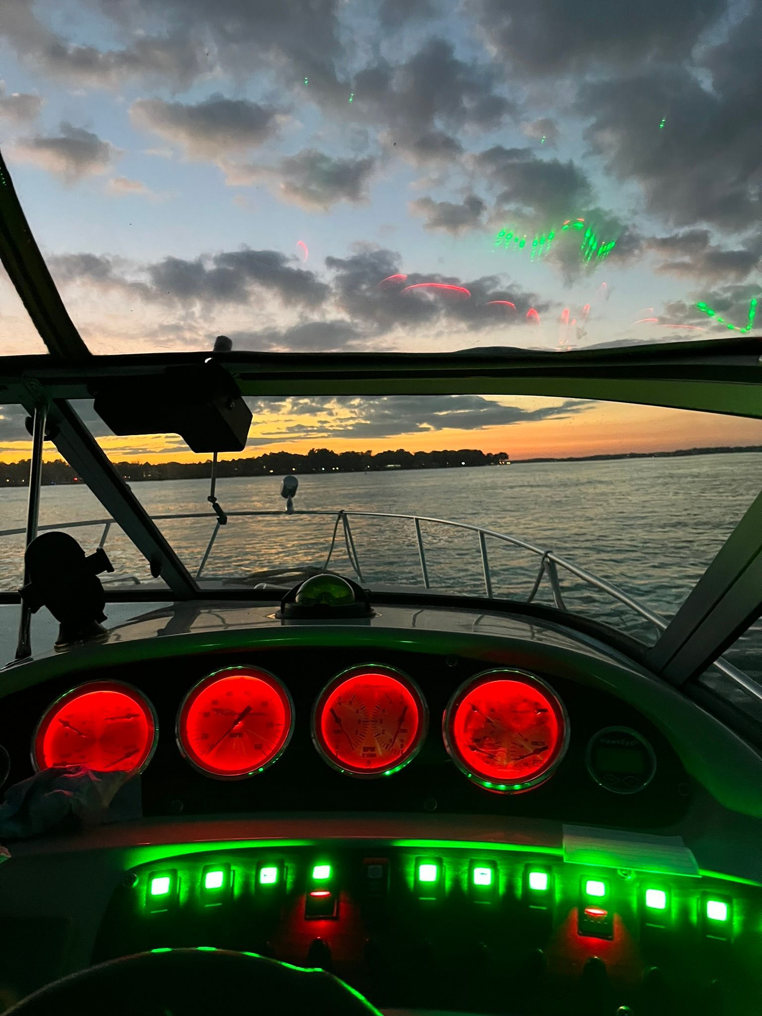 Chaparral Signature 2000 boat at sunset with illuminated dashboard.