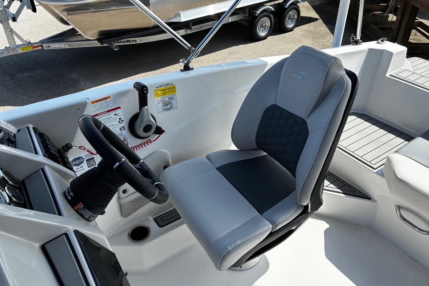 Captain's seat and controls of 2026 Starcraft SVX 191 OB boat.