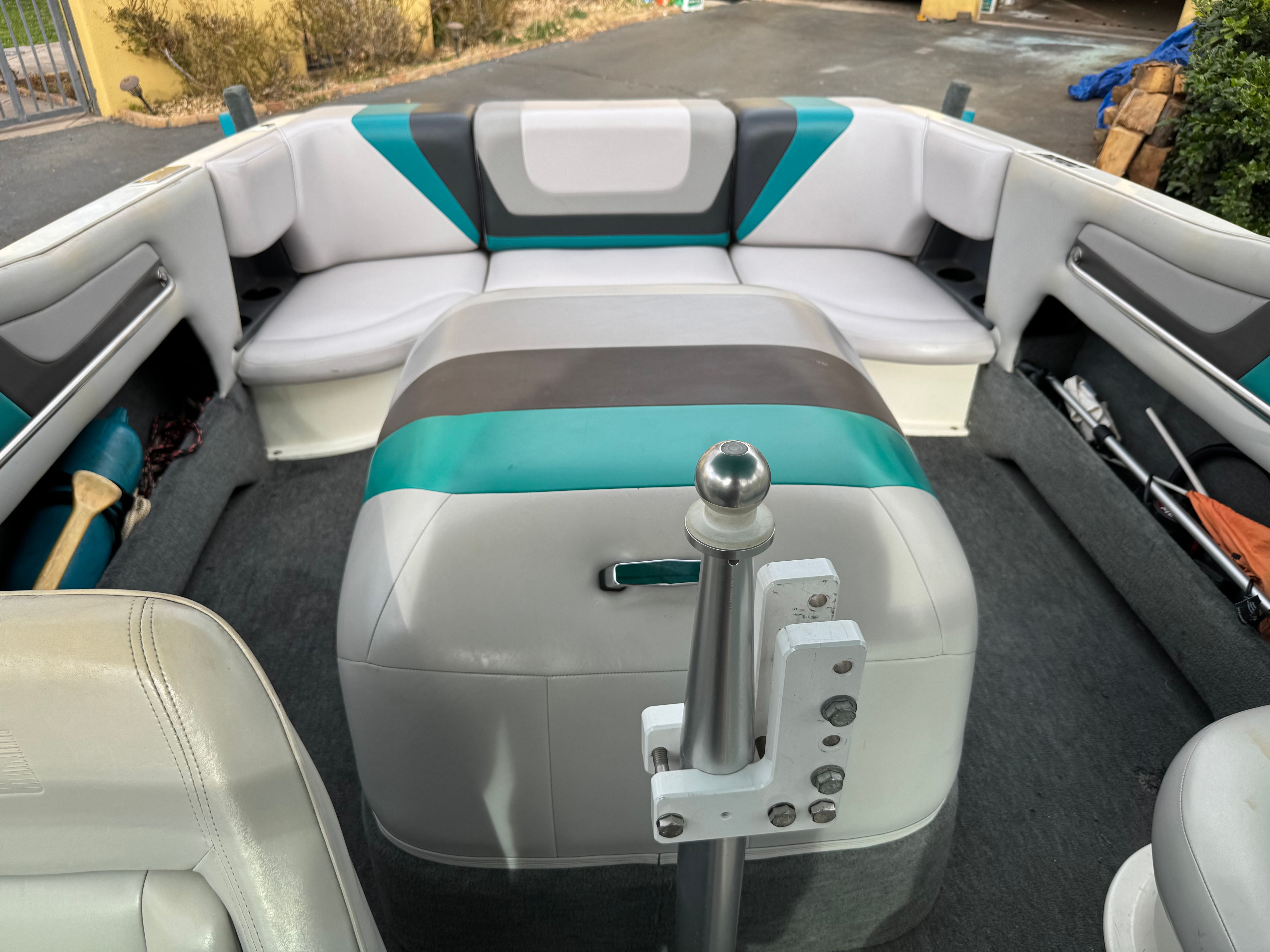 Interior of a 1993 MasterCraft Maristar boat with gray and teal seating.