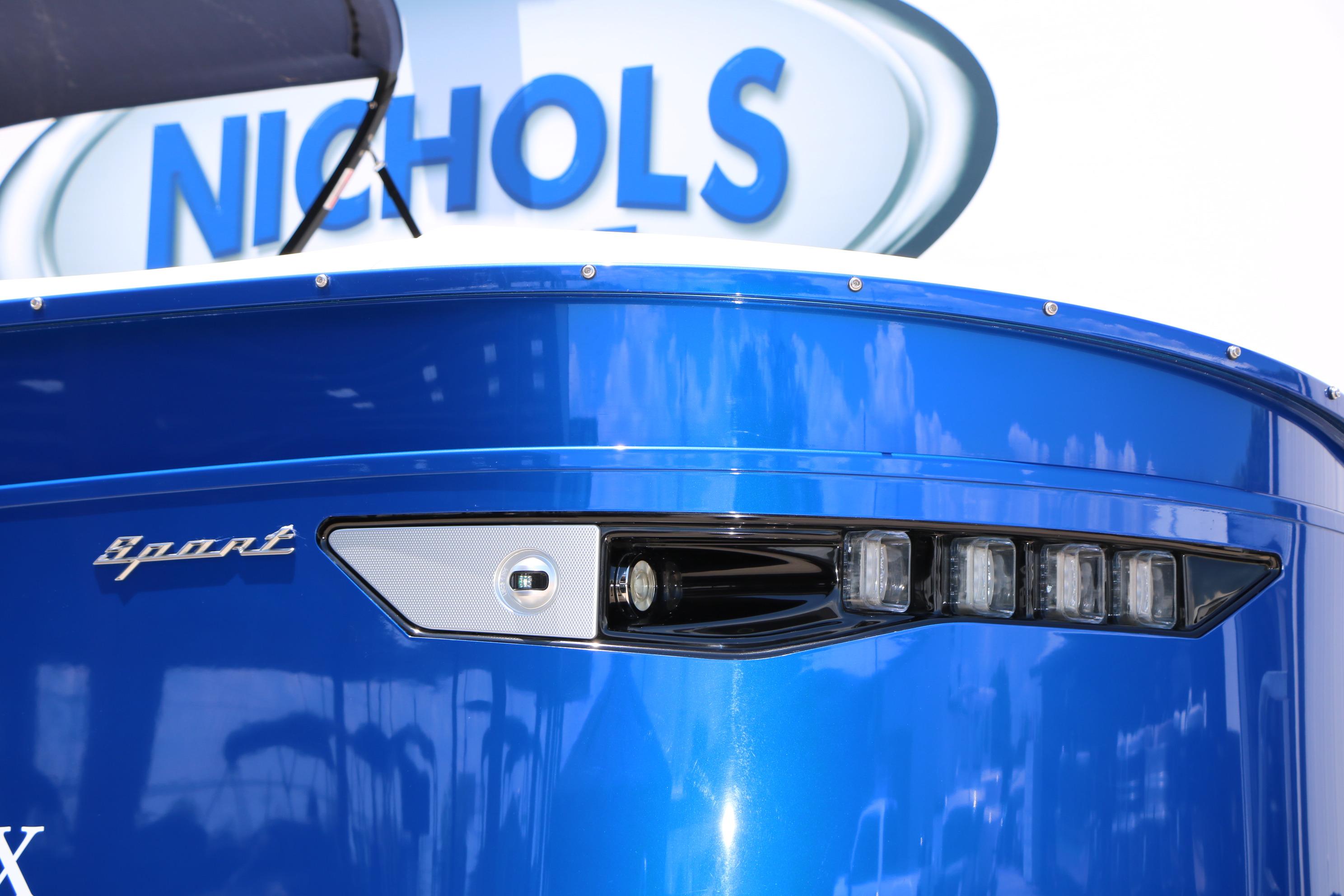 2024 Bennington 23 RX Swingback boat with sleek blue exterior and modern lighting.