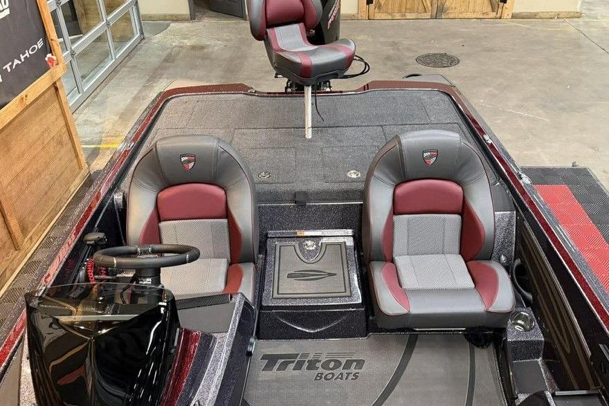 2026 Triton 20XP Patriot boat interior with red and gray seating.