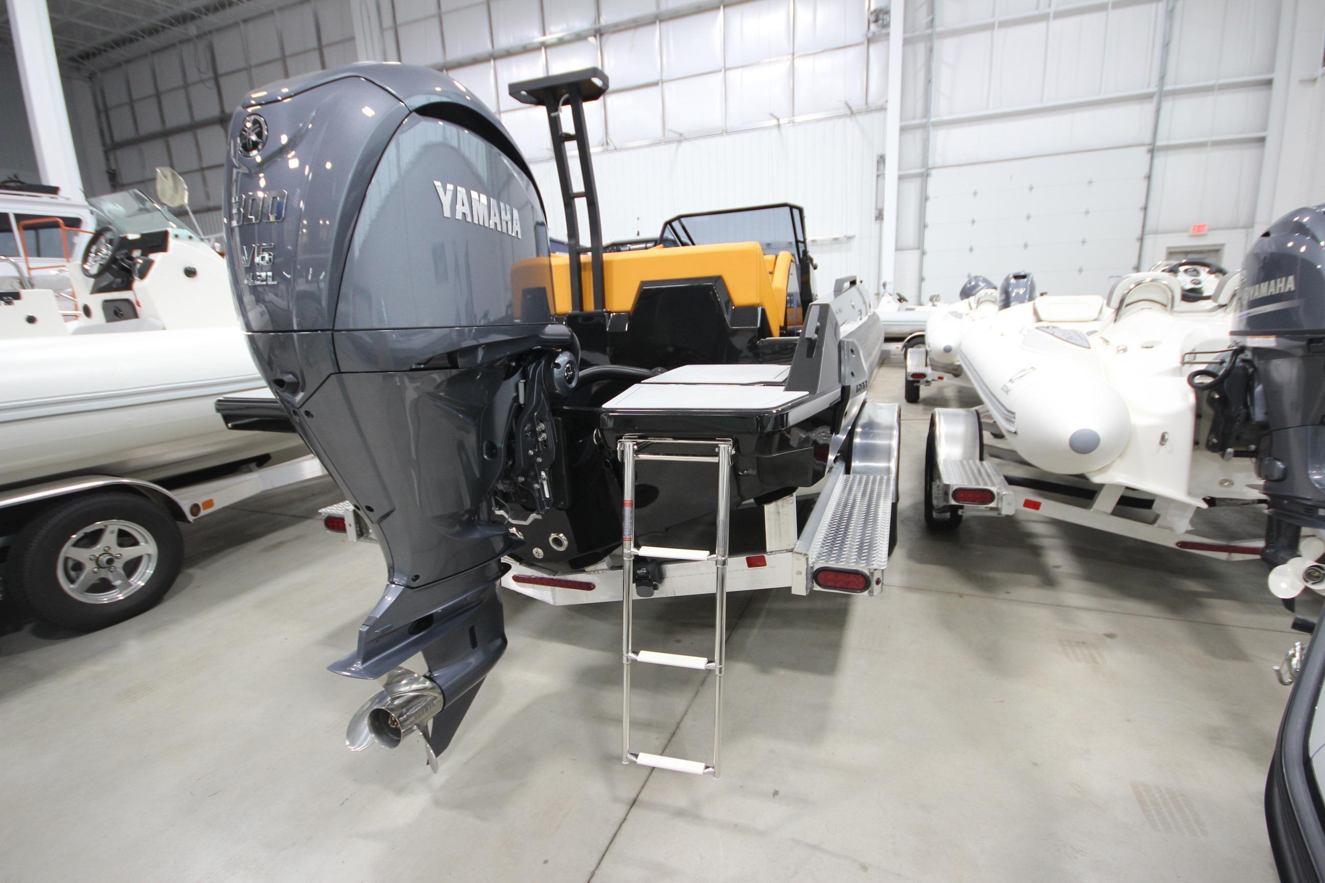 Boat with Yamaha outboard motor in showroom, Iron 767 model, 2026.