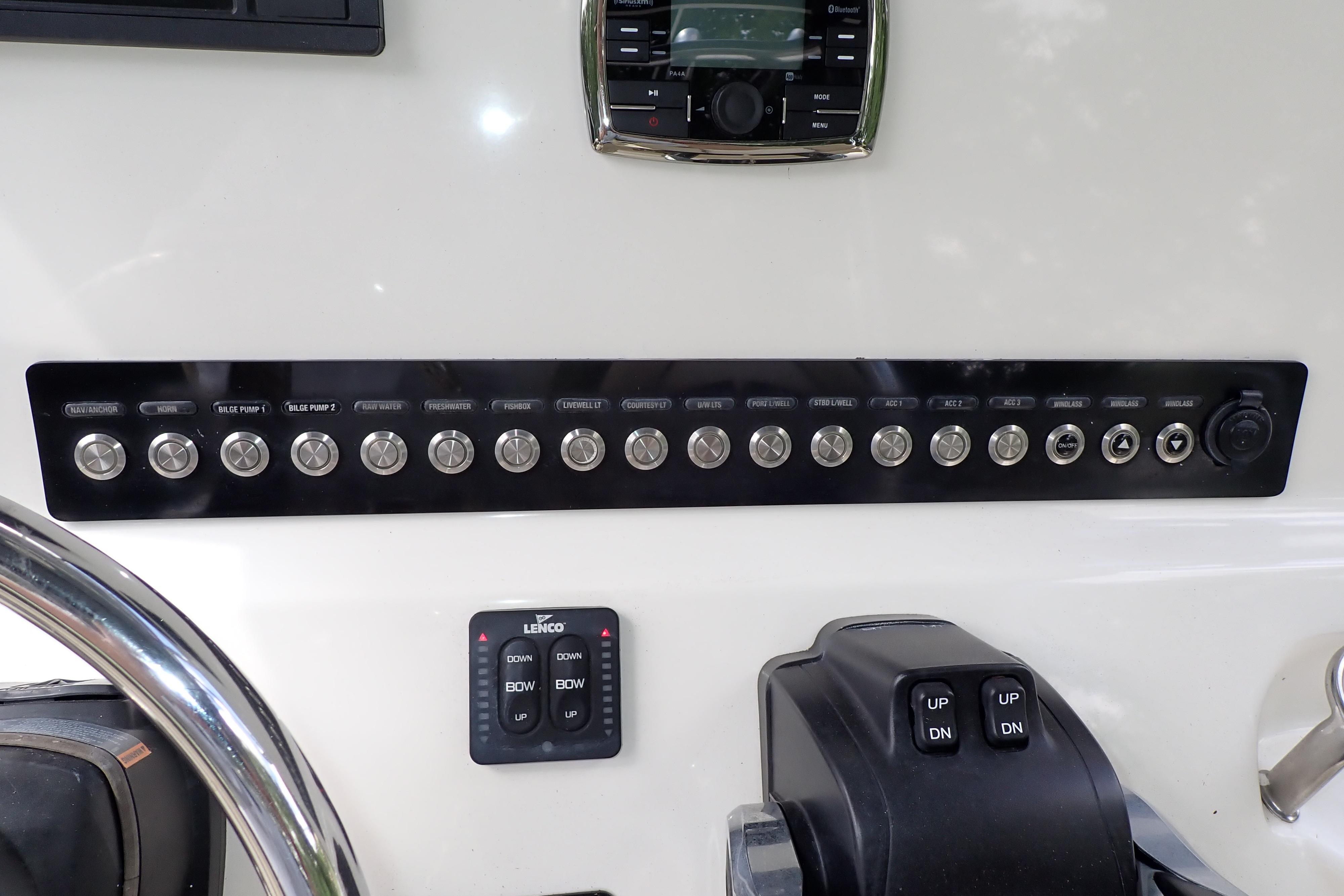 Control panel of a 2019 Key West 263 FS boat with labeled switches and buttons.