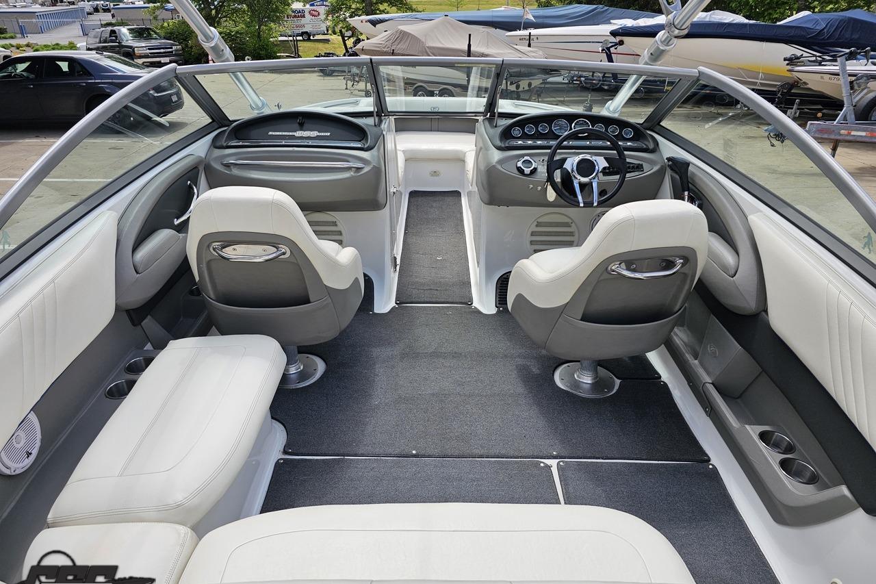 Interior of a 2010 Cobalt 232 WSS boat with sleek seating and modern dashboard.