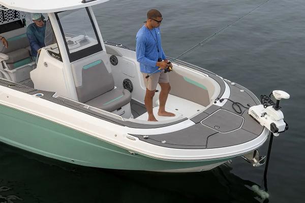Manufacturer Provided Image: 2026 Hurricane Center Console 24 OB boat with anglers fishing on calm water.