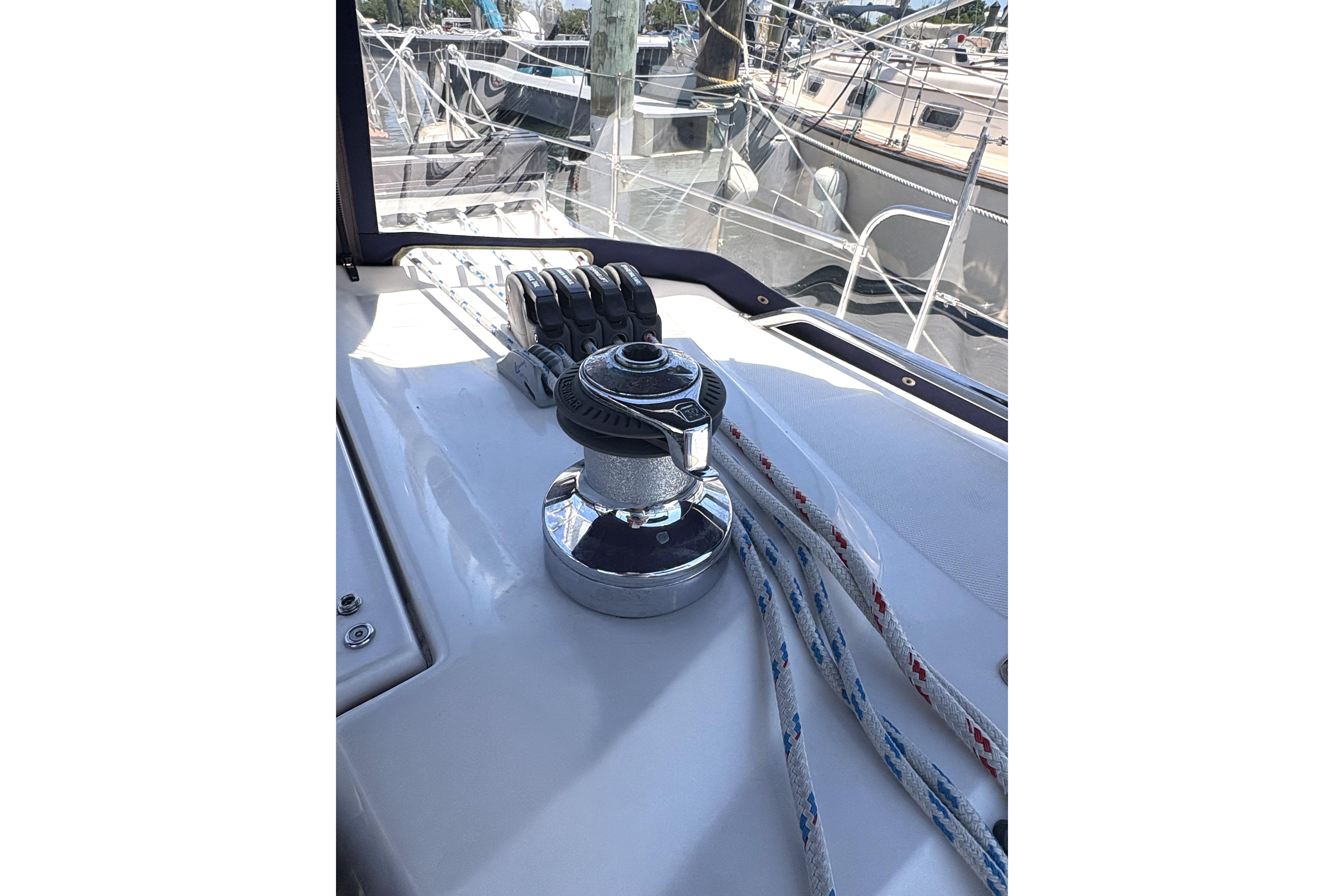Winch and ropes on a 2011 Catalina 355 sailboat deck.