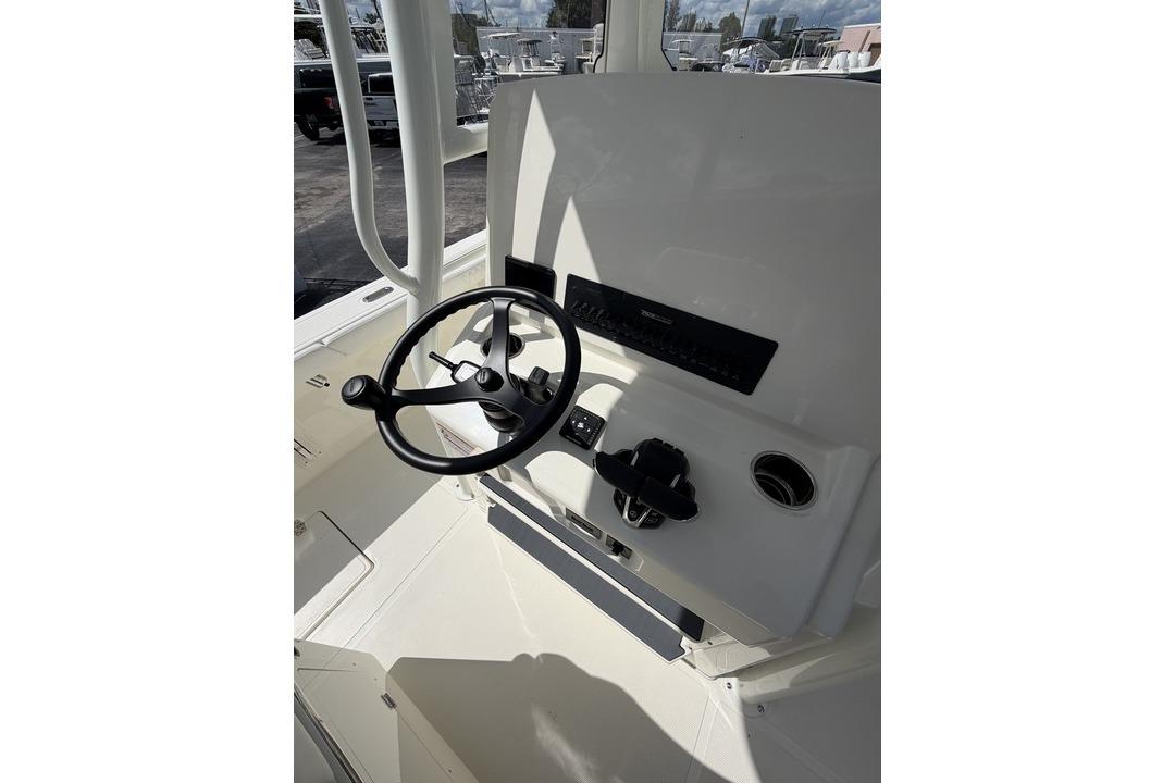 Steering console of 2026 Pathfinder 2800 Hybrid boat, featuring modern controls and sleek design.