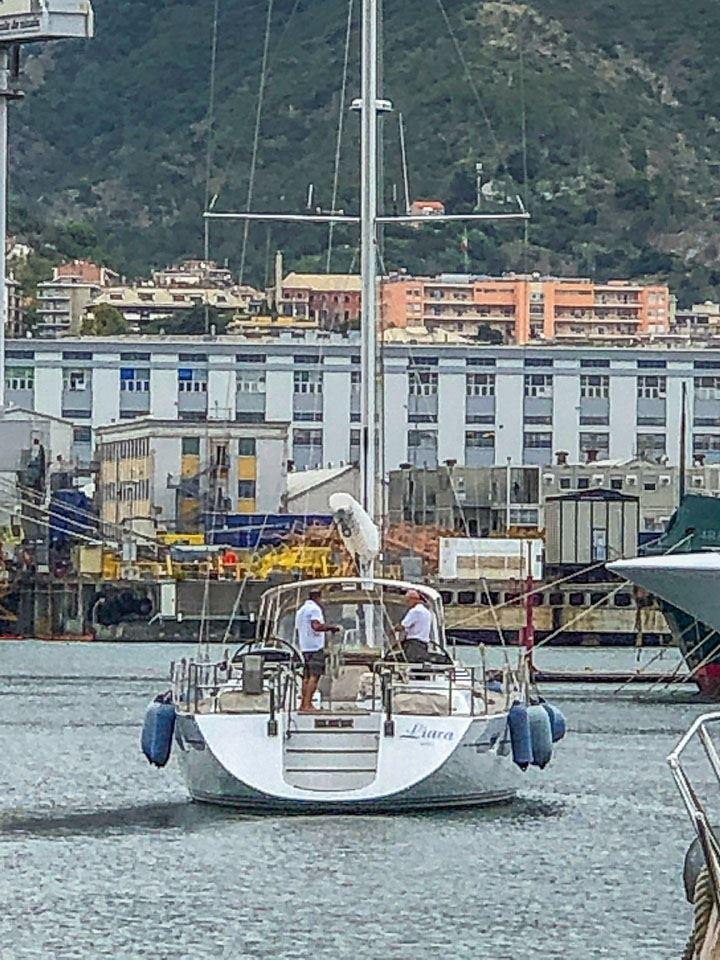 Sailing yacht Southern Ocean Dixon 65, 2002, docked in a marina with urban backdrop.