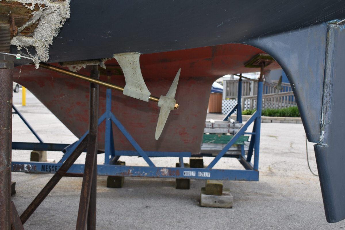 Underside of a 1987 S2 9.2A sailboat showing propeller and hull details.