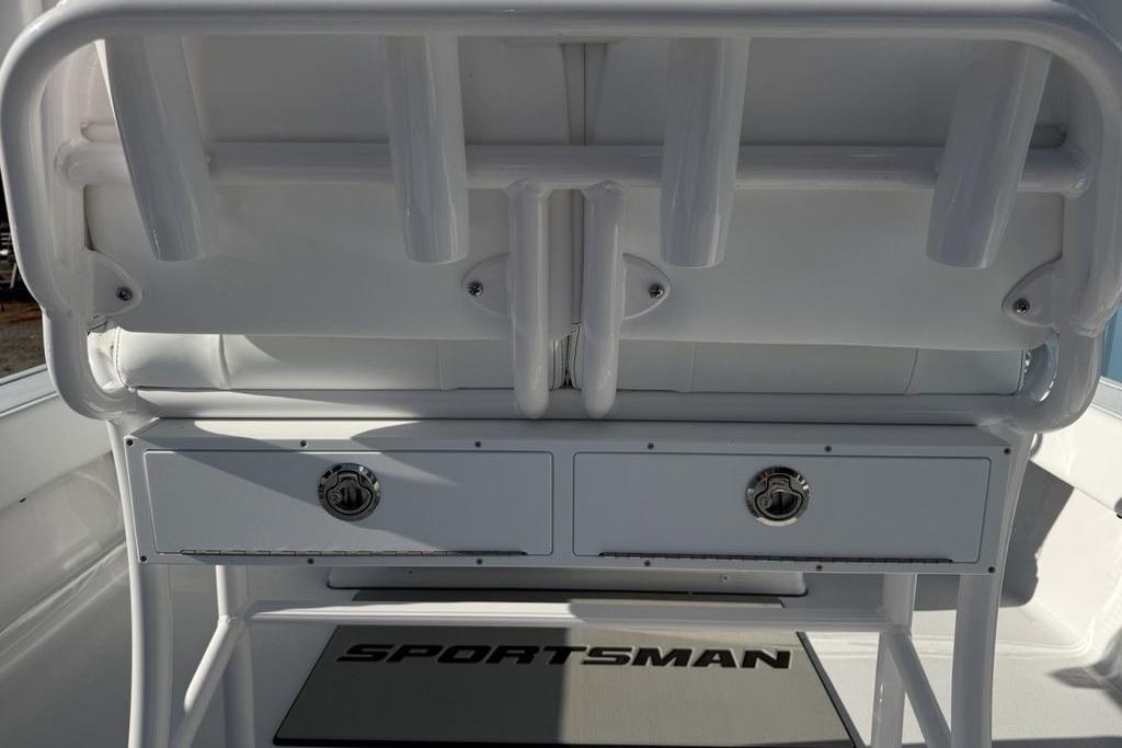2026 Sportsman Masters 247OE Bay Boat interior with storage compartments and rod holders.