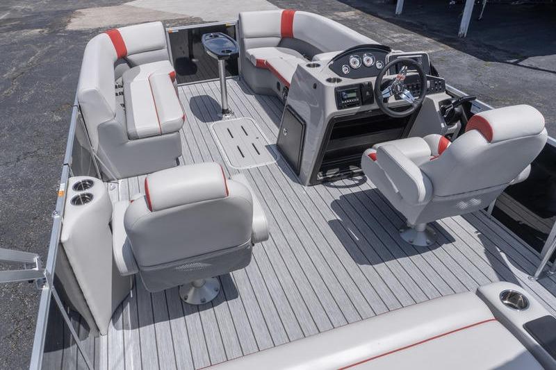 2026 SunCatcher Select 322SL pontoon boat interior with gray seating and modern dashboard.