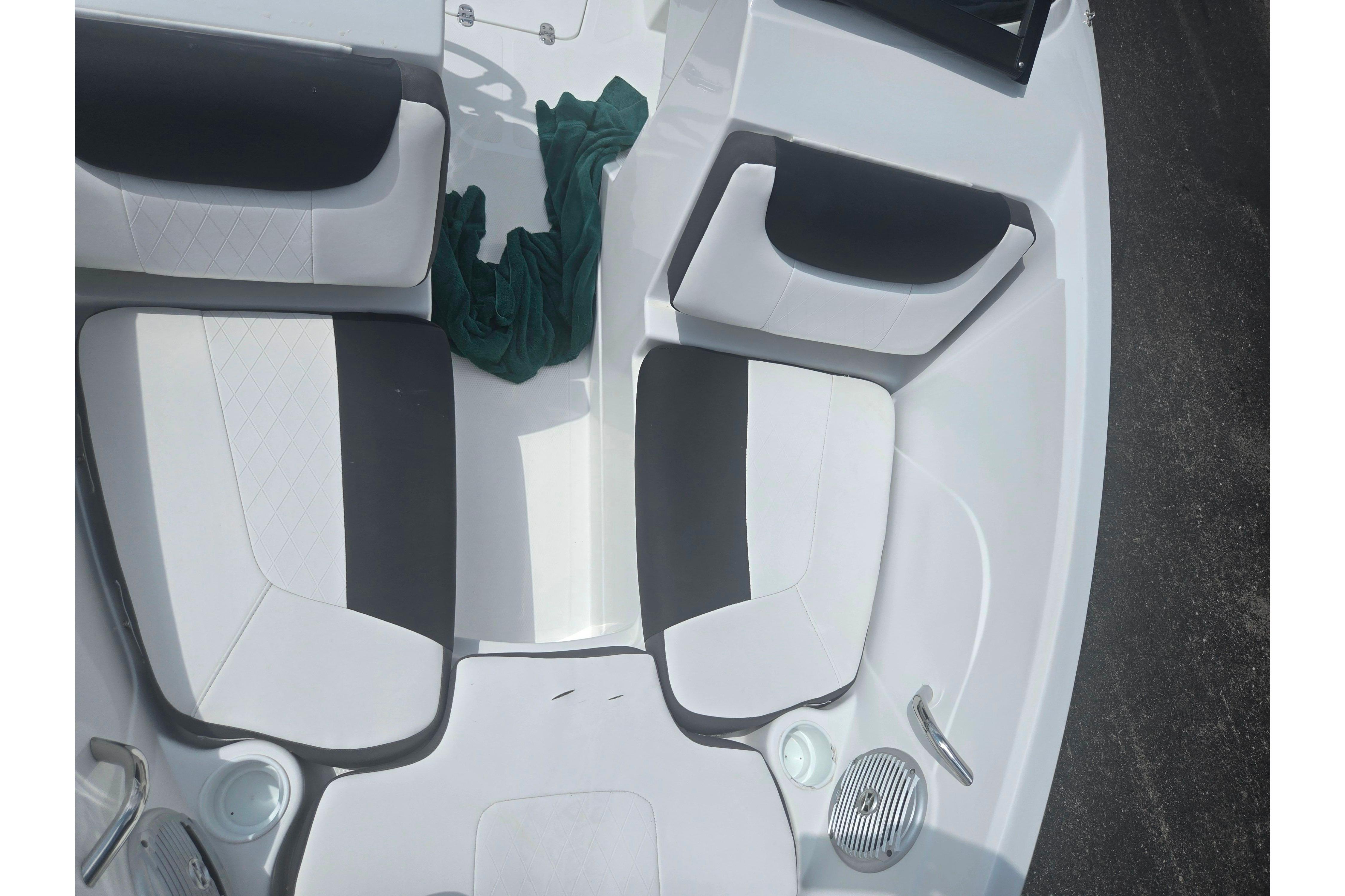 2023 Tahoe 200 S boat interior with white and black seating arrangement.