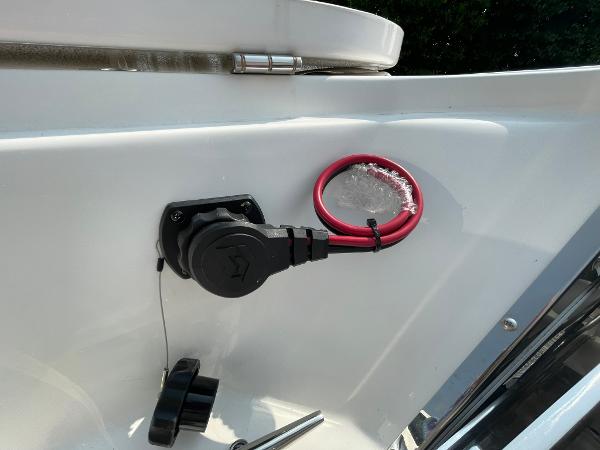 2025 Tidewater 232 CC Adventure boat detail with electrical plug and red wiring.