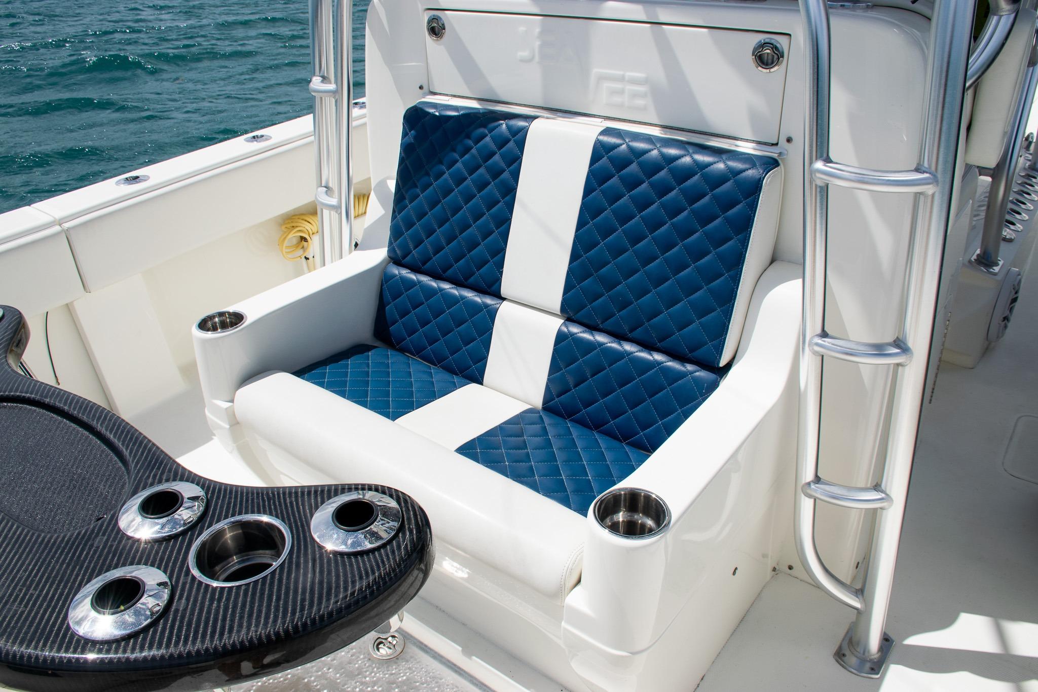 Luxurious seating on 2022 SeaVee 390Z boat with quilted blue and white upholstery.