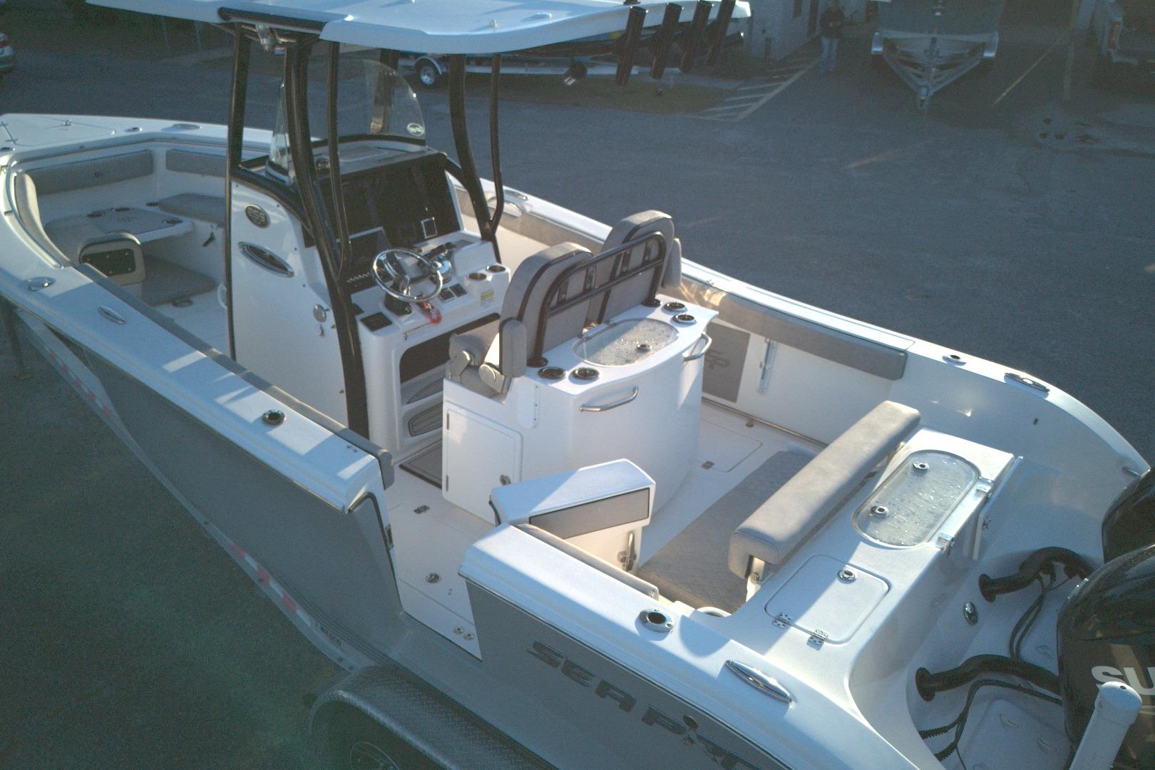 2021 Sea Pro 259 Center Console boat with spacious deck and modern helm.