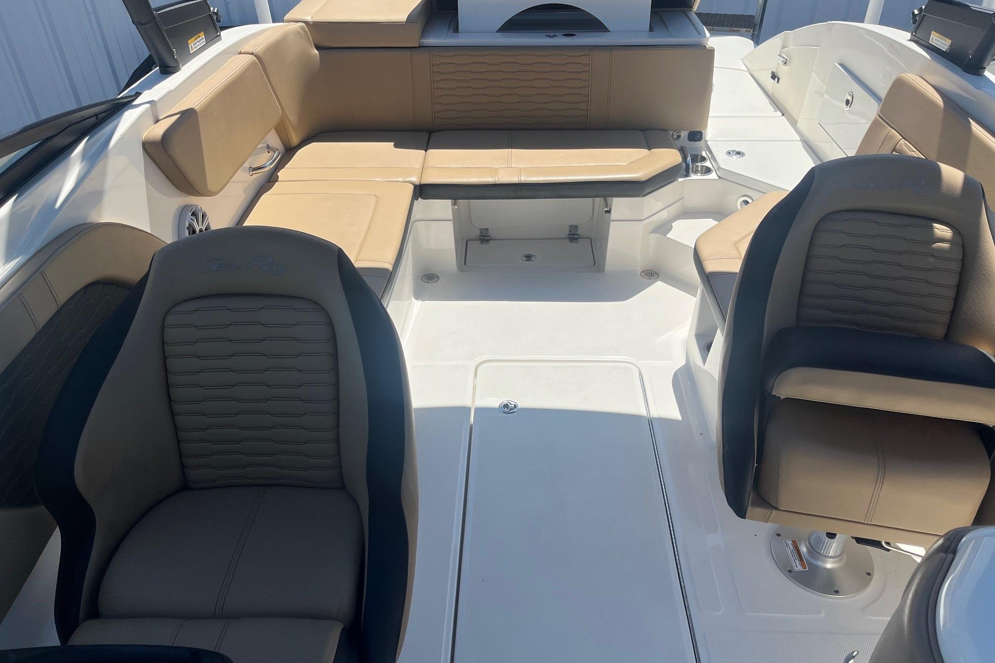 2024 Sea Ray SPX 230 boat interior with tan seating and modern design.