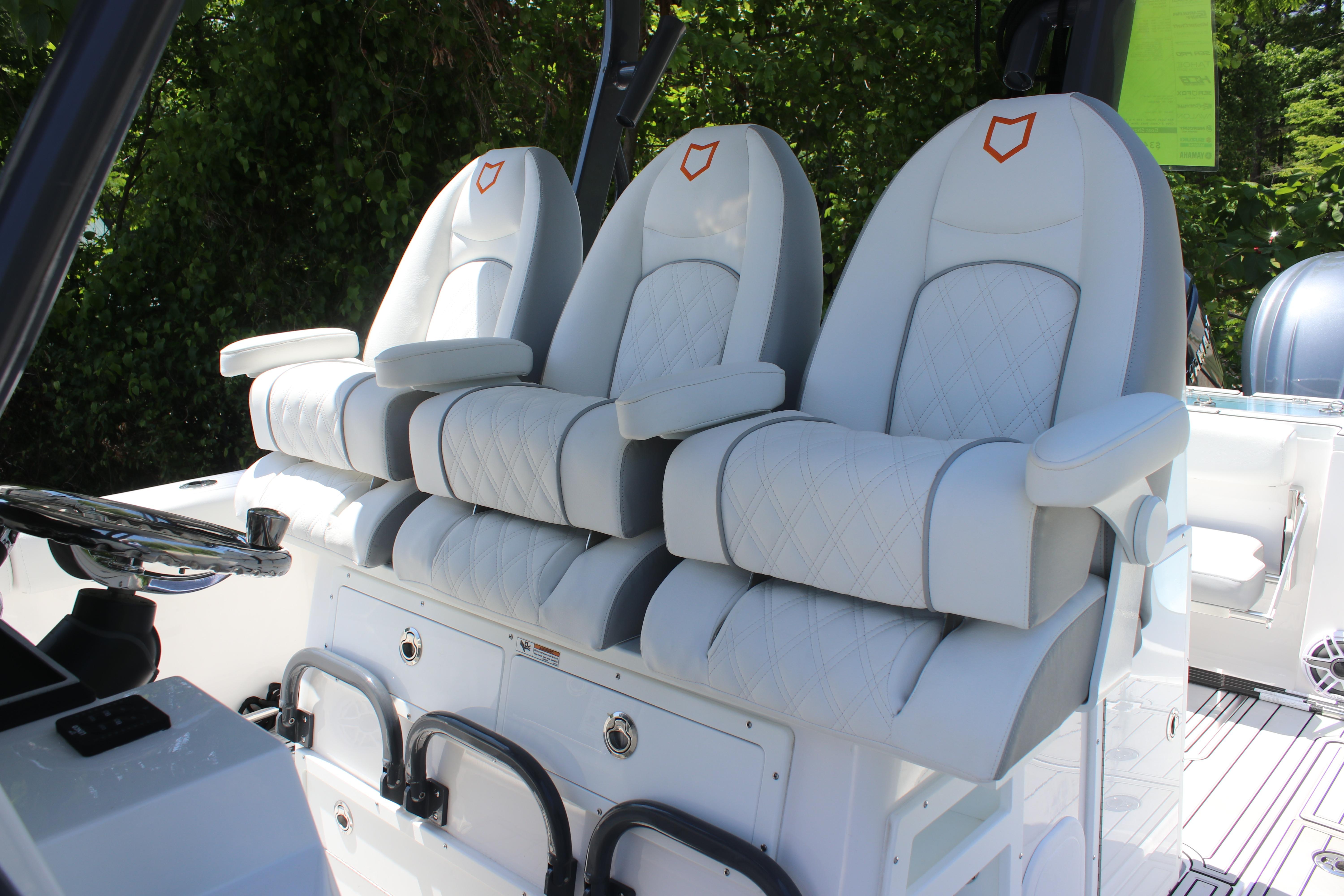 2025 Sea Fox 328 Commander boat with luxurious white seating and modern helm design.