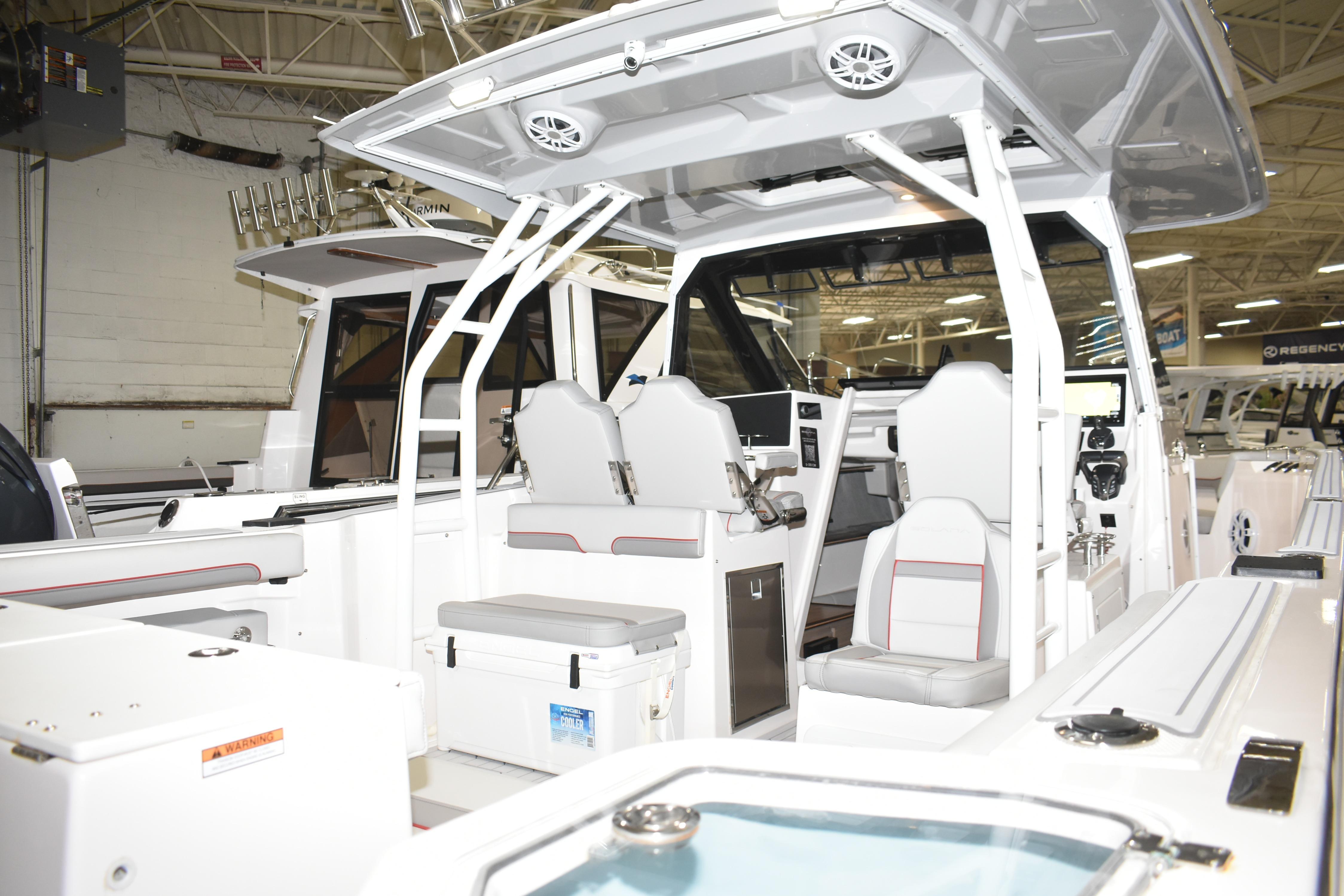 2025 Solara S-310 CW boat interior with modern seating and navigation equipment.