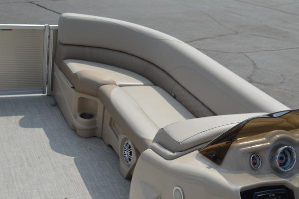 2018 Tahoe LTZ 2285 CR boat interior with beige seating and dashboard.
