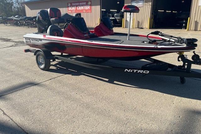 2026 Nitro Z17 boat on trailer, parked outside a boat center.