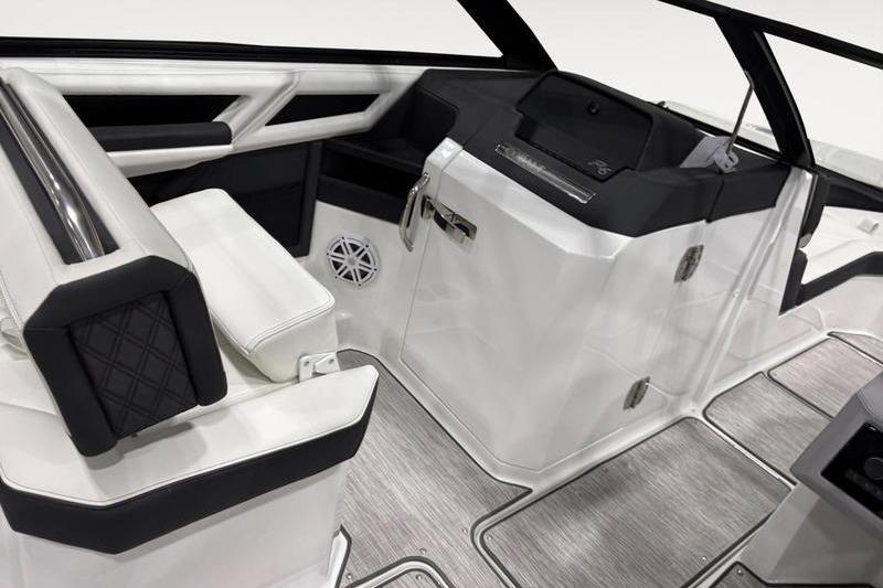 Interior of 2025 Cobalt R6 boat featuring sleek white and black seating and modern design.